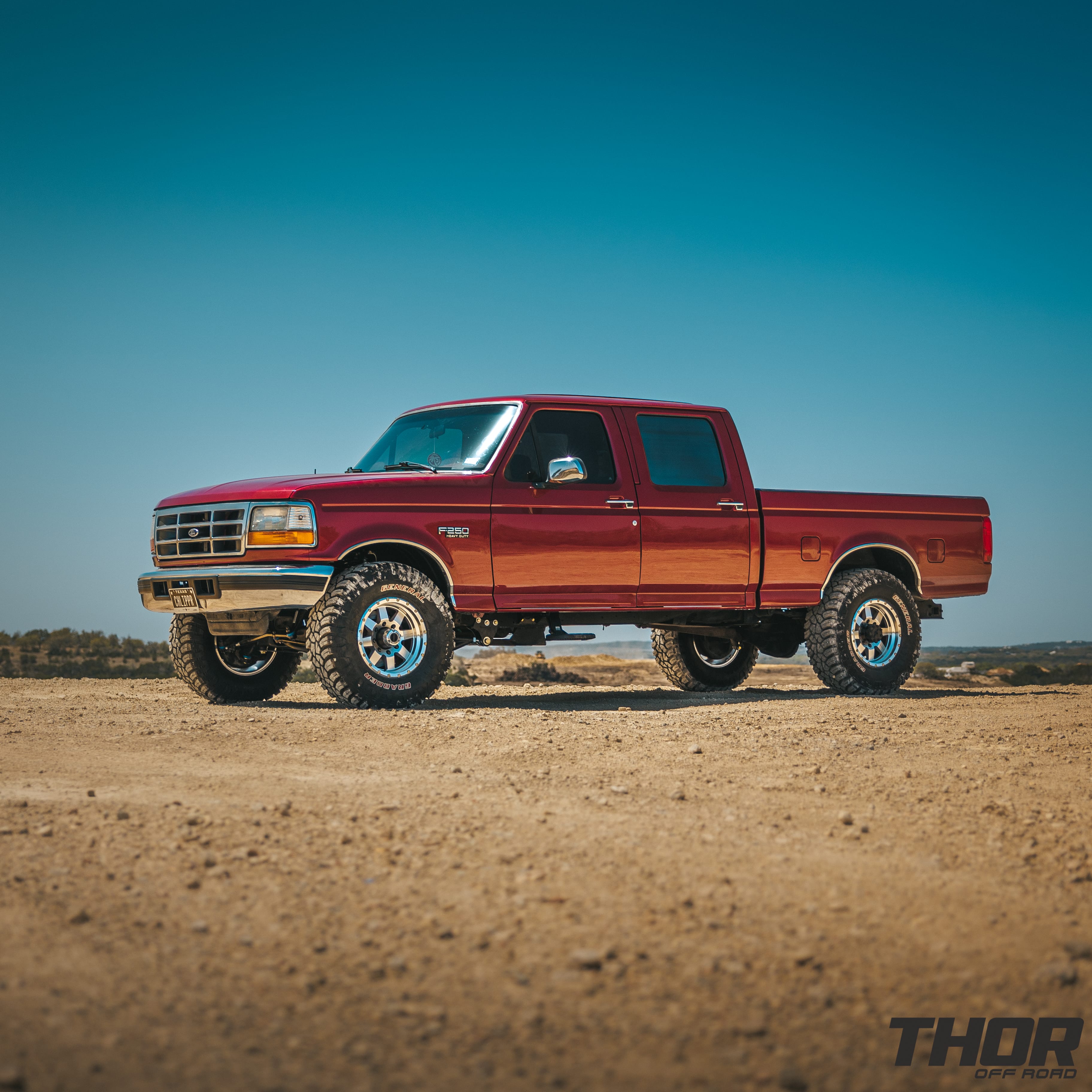 1997 Ford F-250 Super Duty XLT in Red with Bilstein Coil Over Conversion, Rear Leaf Spring Replacement, 17" Raceline Defender Wheels, 35x12.50R17 General Grabber MT Tires