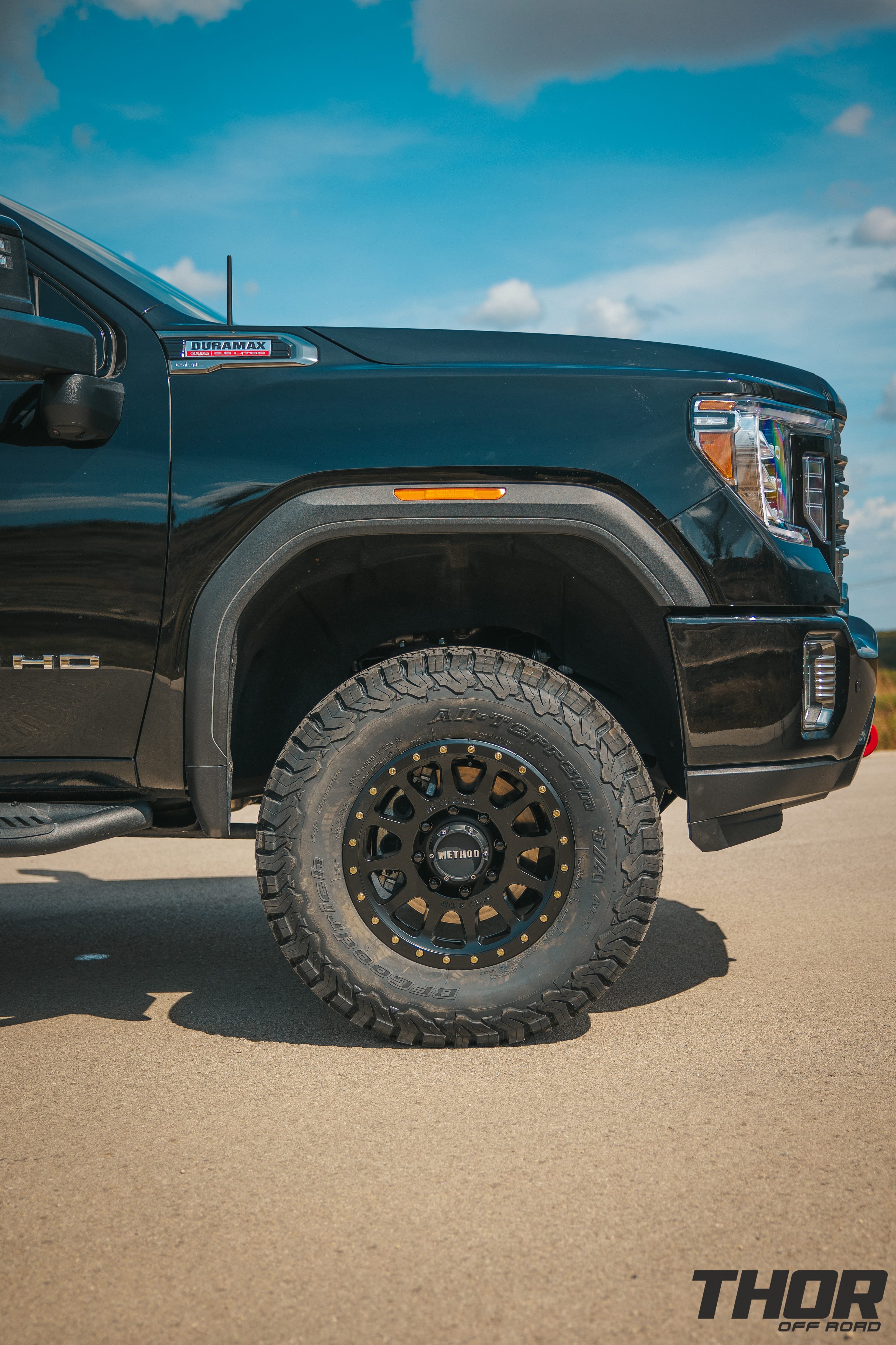 2022 GMC Sierra 2500 HD AT4 in Onyx Black with 3" Cognito Performance Suspension Kit, 18" Method 305 NV Wheels, 35x12.50R18 BFG KO2 Tires, ReadyLift Air Bag Kit