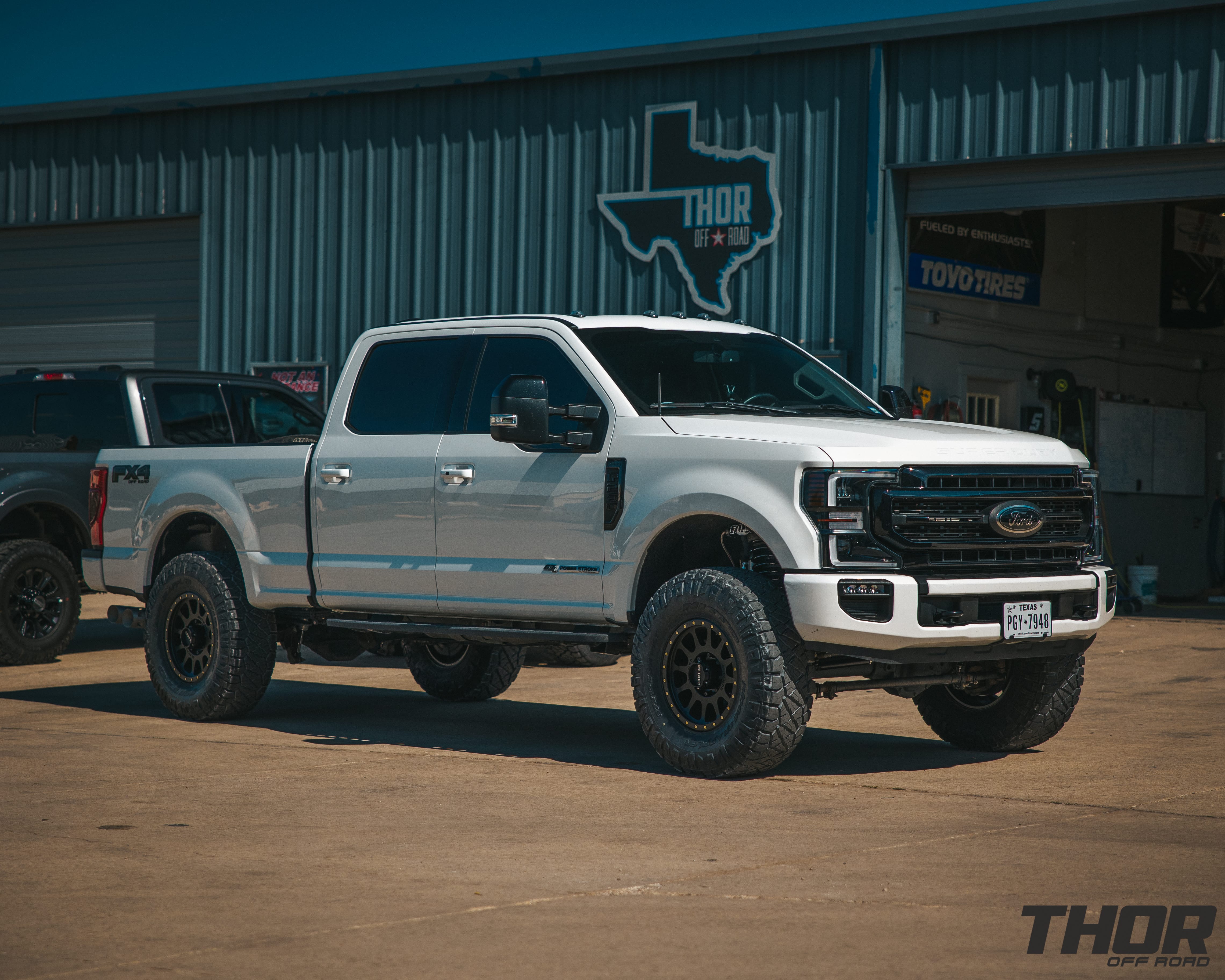 2022 Ford F-250 Super Duty Lariat in White with 3.5" Carli Backcountry Suspension, Carli Full Rear Leaf Springs, 18x9" Method 305NV Wheels, 3712.50R18 Nitto Ridge Grappler Tires