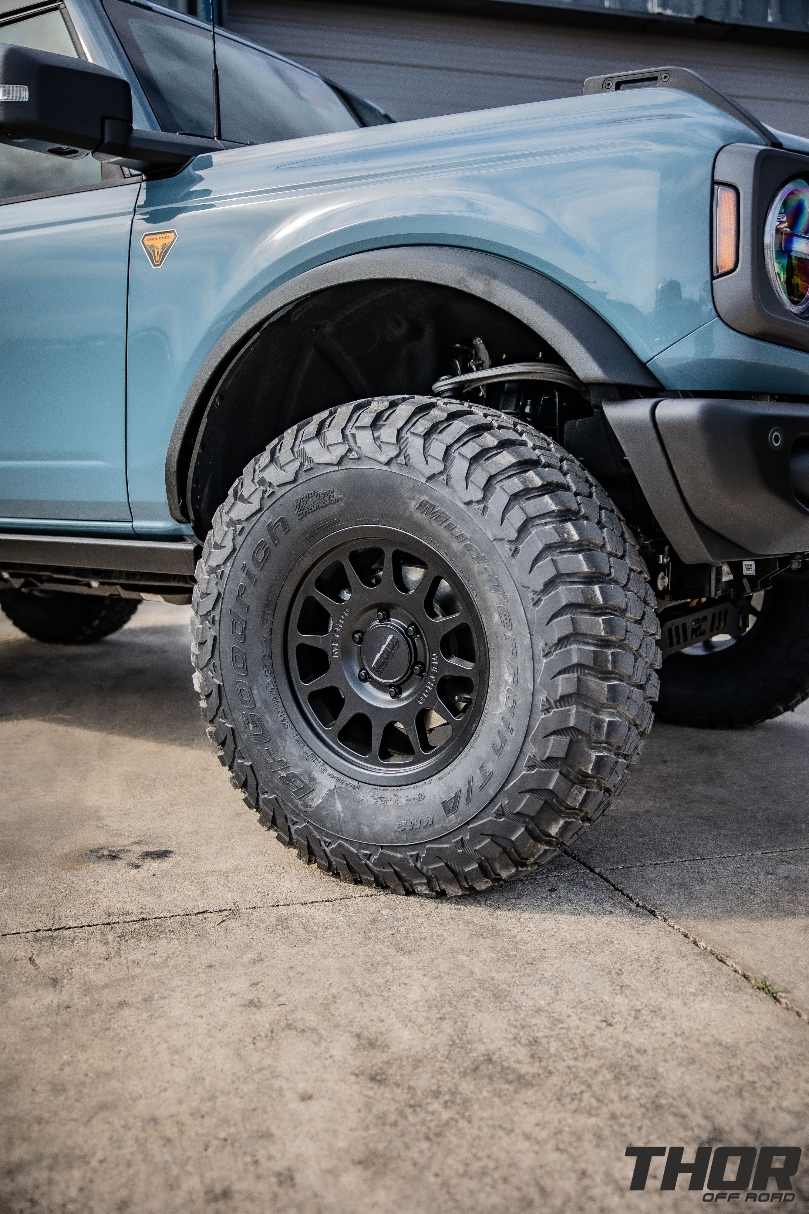 2022 Ford Bronco Badlands in Blue with Rough Country 5" Badlands Lift Kit, Method 703 17x8.5" Wheels, 37x12.50R17 BFGoodrich KM3 Tires