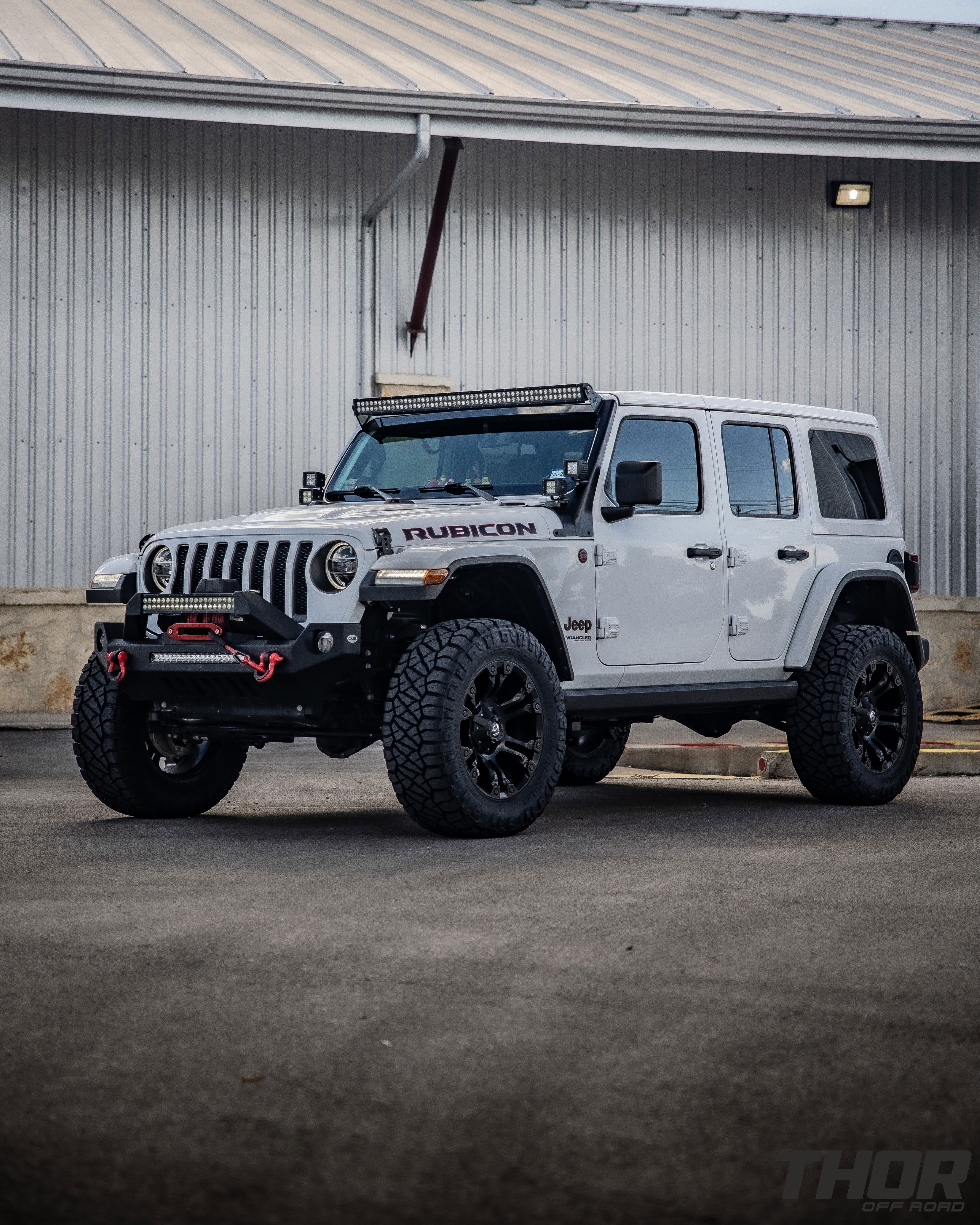 2022 Jeep Wrangler Unlimited Rubicon in White with 3" Lift Kit, Power Running Boards, Nitto Ridge Grappler 35x12.50R20, S&B Cold Air Intake, Auxillary Lighting