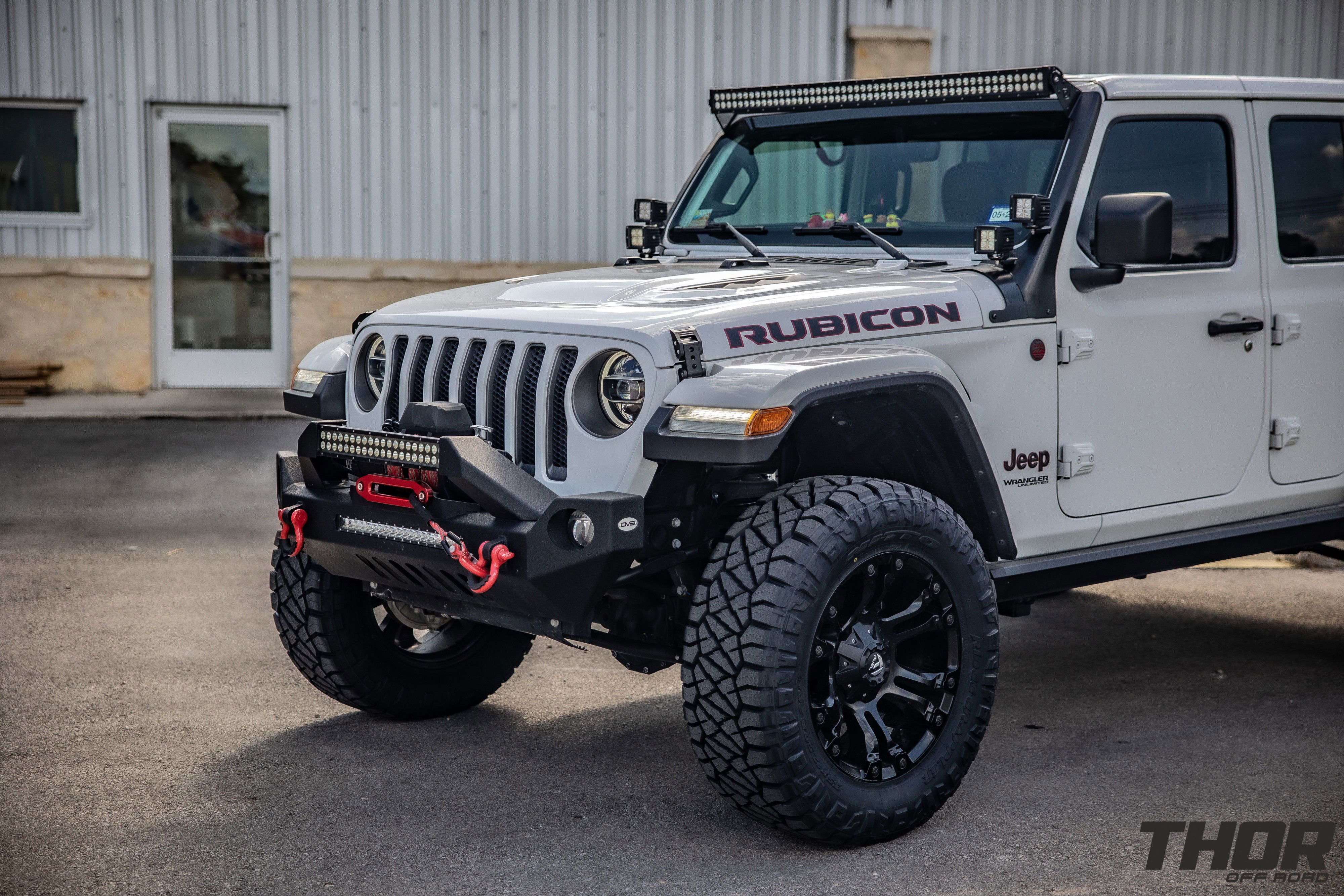 2022 Jeep Wrangler Unlimited Rubicon in White with 3" Lift Kit, Power Running Boards, Nitto Ridge Grappler 35x12.50R20, S&B Cold Air Intake, Auxillary Lighting