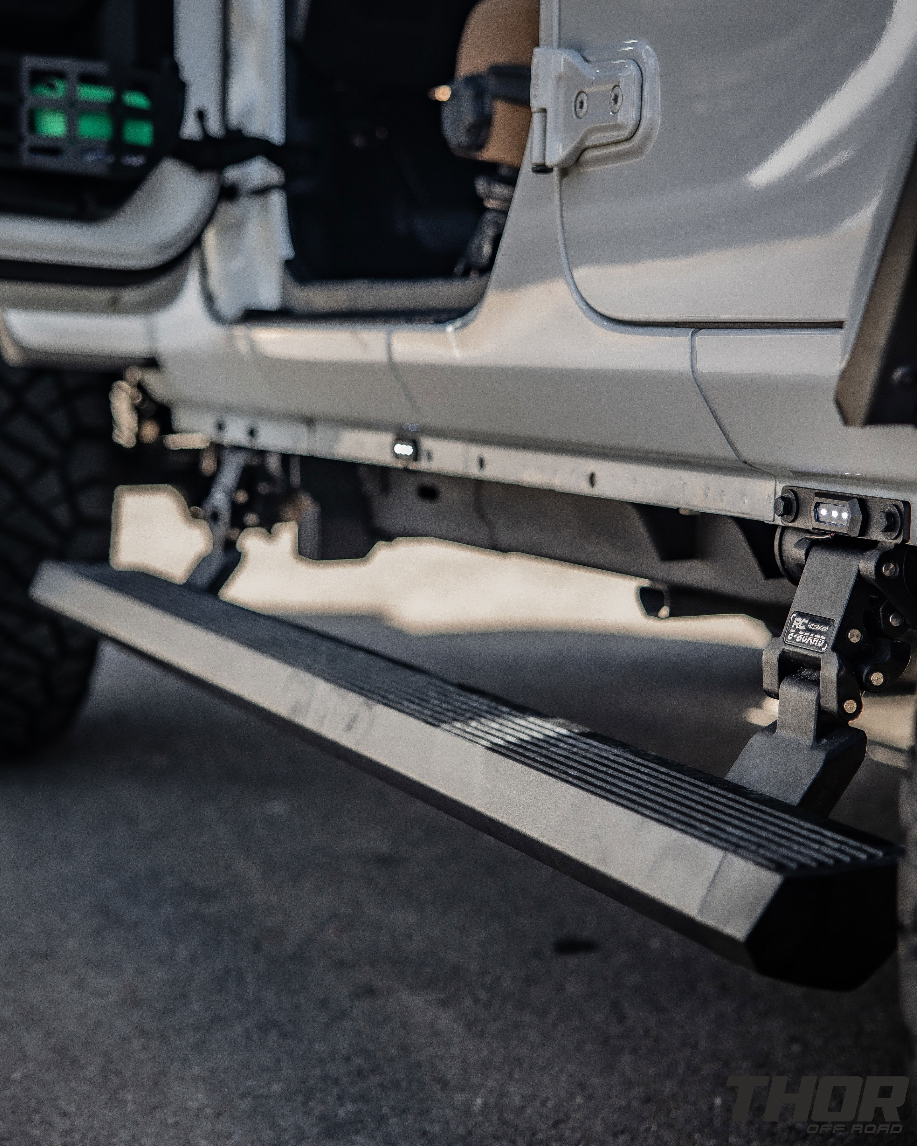 2022 Jeep Wrangler Unlimited Rubicon in White with 3" Lift Kit, Power Running Boards, Nitto Ridge Grappler 35x12.50R20, S&B Cold Air Intake, Auxillary Lighting