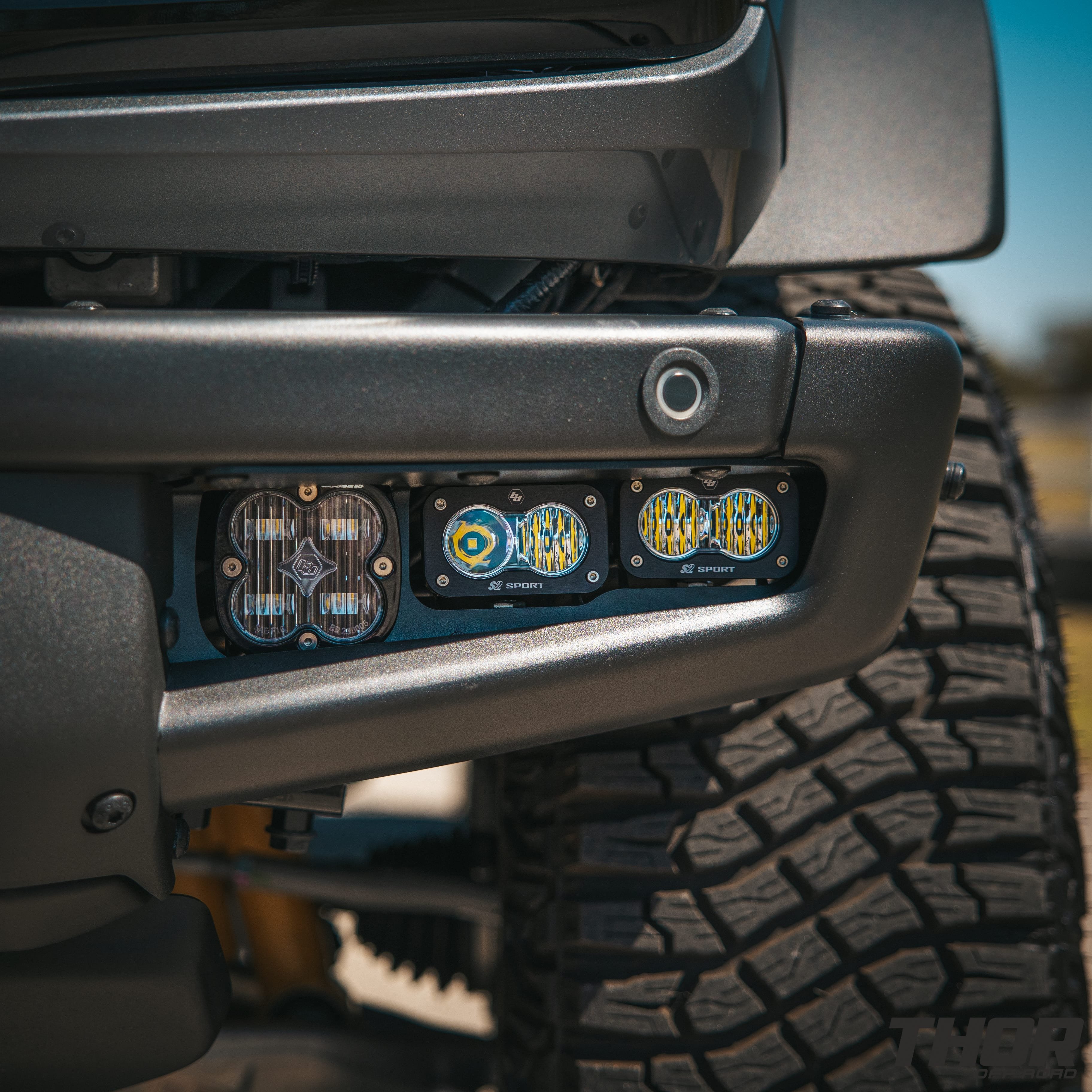 2022 Ford Bronco Wildtrak in Grey with 1" Rough Country Level Kit, 17x8.5" Method MR704 Wheels, Baja Design Fog Light Pocket Kit