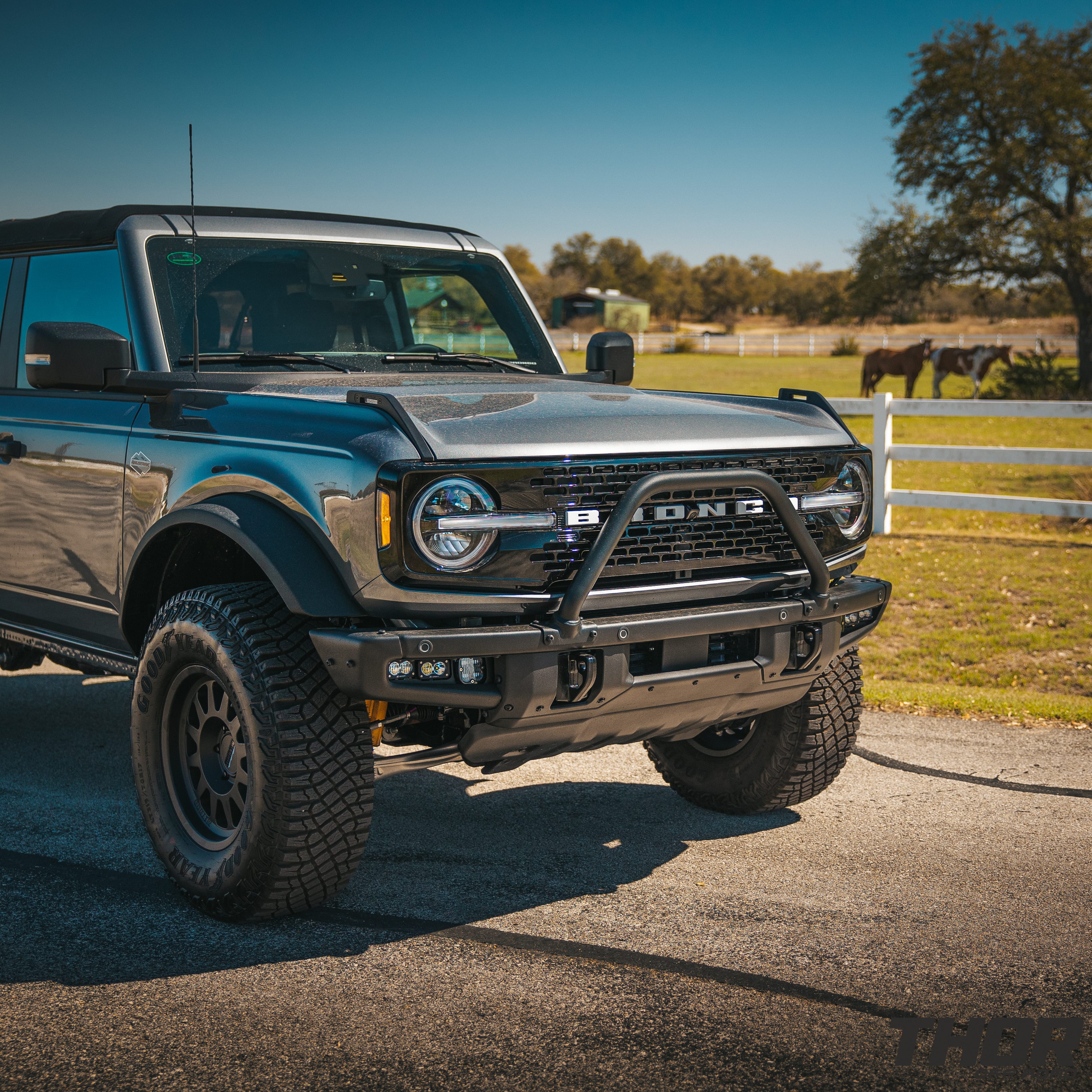 2022 Ford Bronco Wildtrak in Grey with 1" Rough Country Level Kit, 17x8.5" Method MR704 Wheels, Baja Design Fog Light Pocket Kit