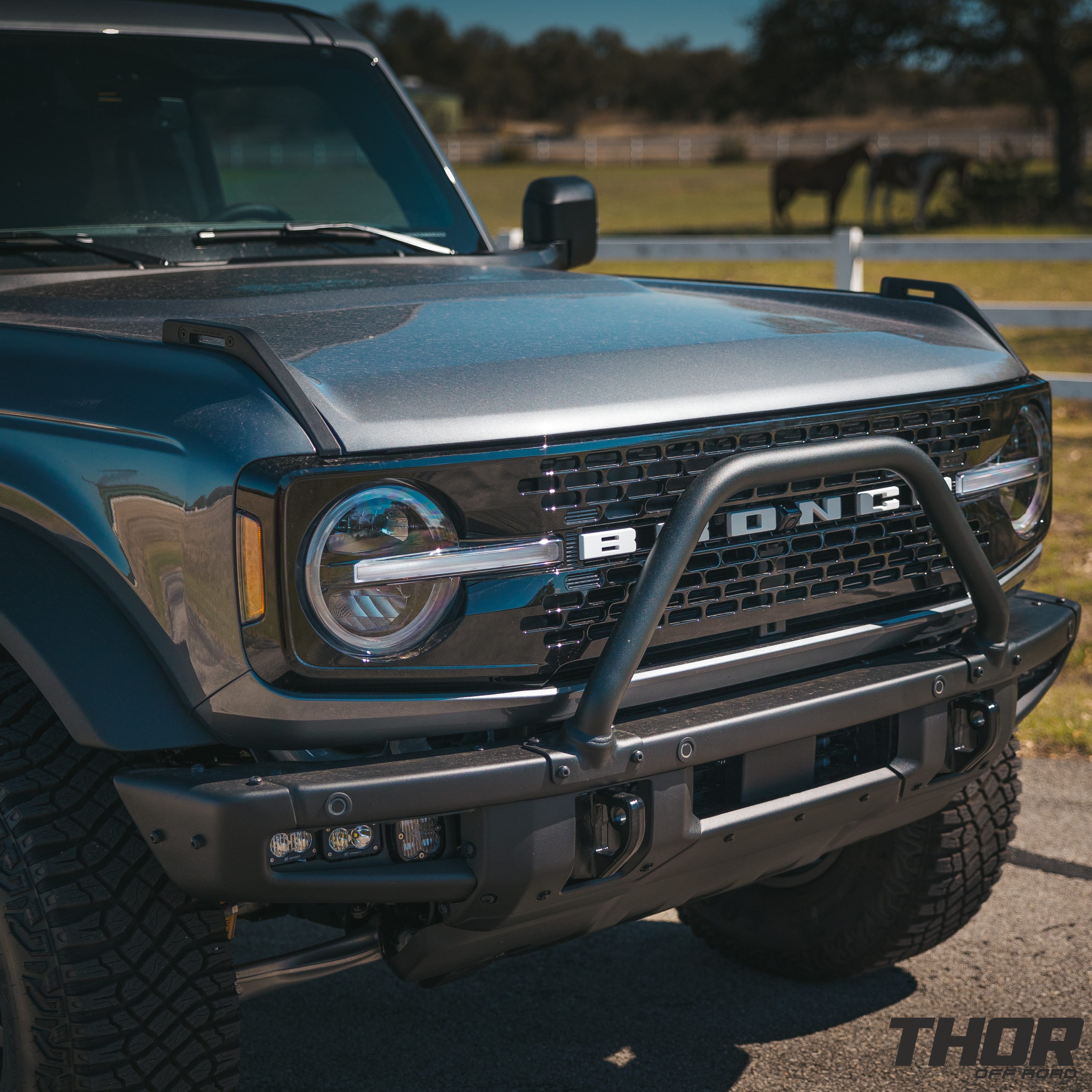 2022 Ford Bronco Wildtrak in Grey with 1" Rough Country Level Kit, 17x8.5" Method MR704 Wheels, Baja Design Fog Light Pocket Kit