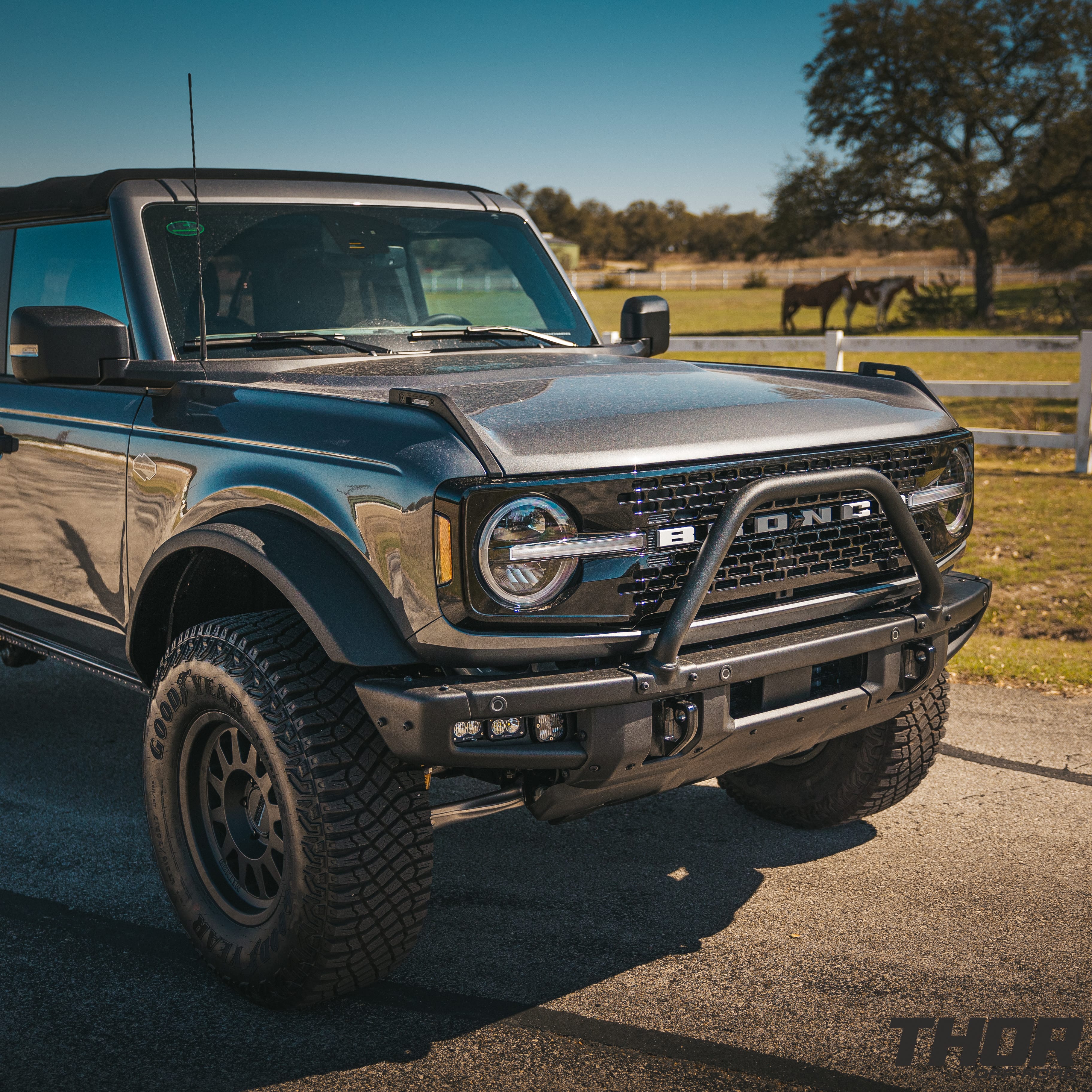 2022 Ford Bronco Wildtrak in Grey with 1" Rough Country Level Kit, 17x8.5" Method MR704 Wheels, Baja Design Fog Light Pocket Kit