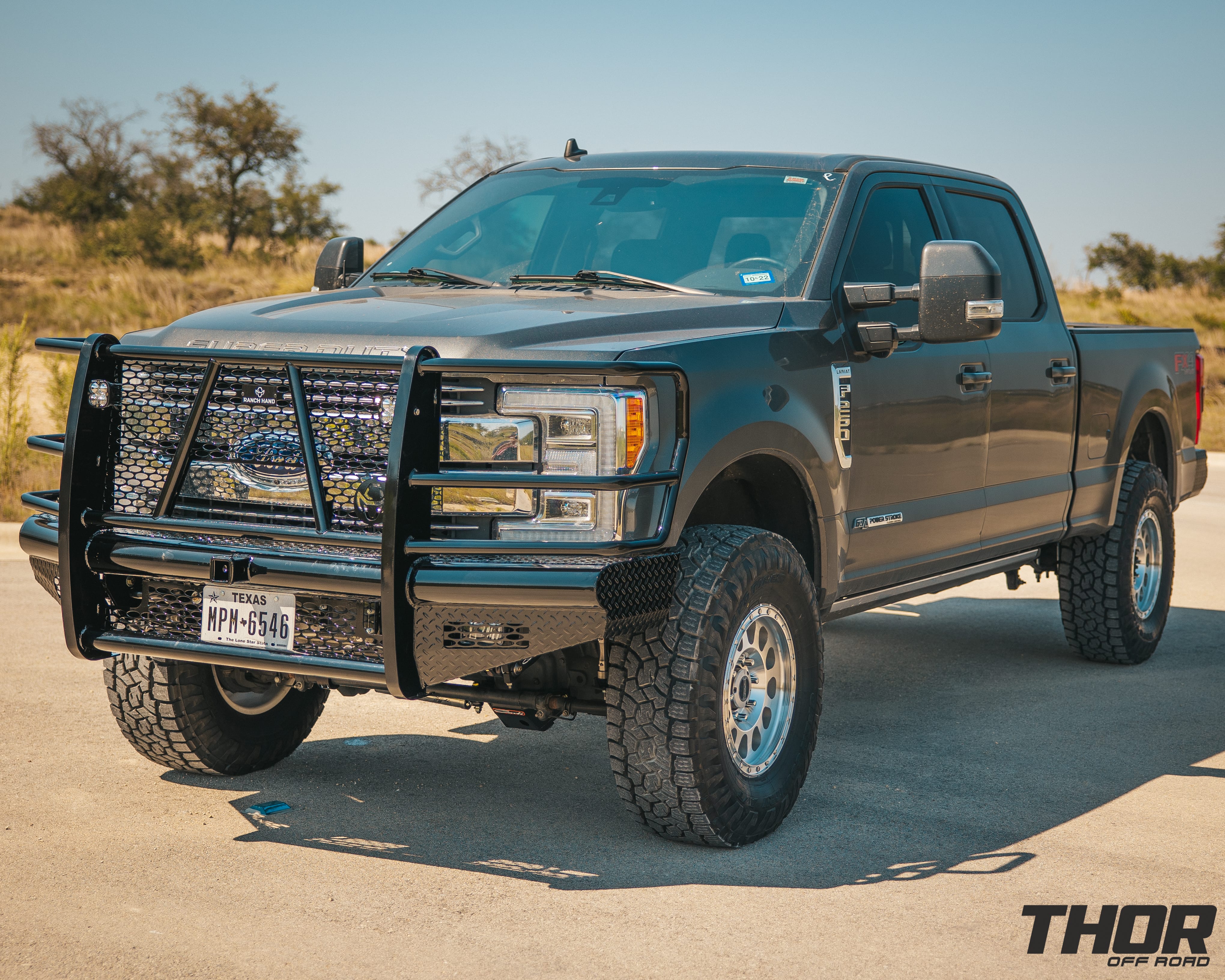 2019 Ford F-250 Super Duty Lariat in Grey with Carli 3.5" Suspension Kit, Carli Low Mount Steering Stabilizer, Carli High Mount Steering Stabilizer, Carli Add-A-Pack Spring Replacement, Carli Torsion Sway Bar, Method 315 18x9" Machine Finished Wheels, Toyo ATIII 37x12.50R18 Tires, Ranch Hand Legend Front and Rear Bumpers, Baja Design Squadron Lighting