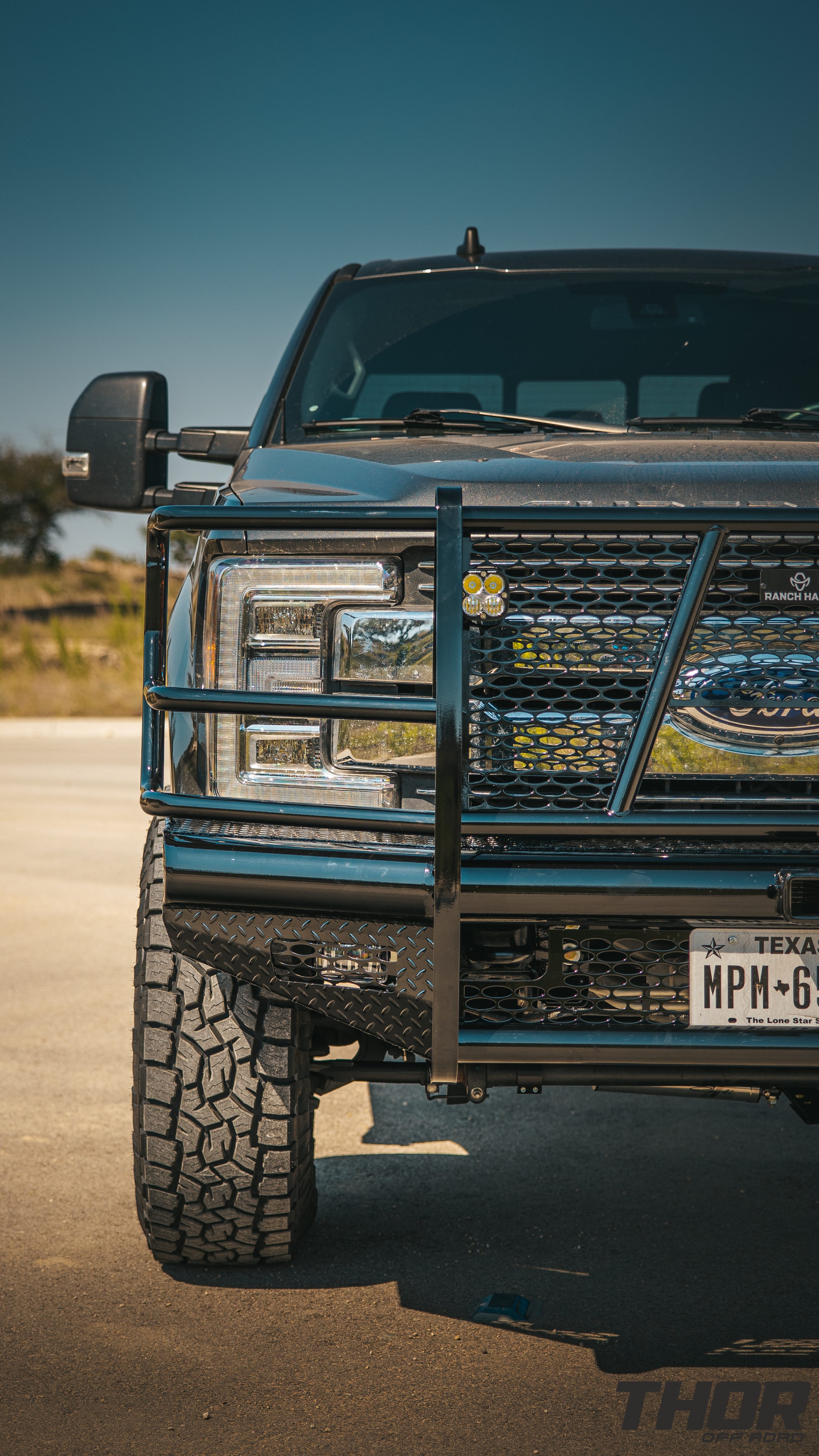 2019 Ford F-250 Super Duty Lariat in Grey with Carli 3.5" Suspension Kit, Carli Low Mount Steering Stabilizer, Carli High Mount Steering Stabilizer, Carli Add-A-Pack Spring Replacement, Carli Torsion Sway Bar, Method 315 18x9" Machine Finished Wheels, Toyo ATIII 37x12.50R18 Tires, Ranch Hand Legend Front and Rear Bumpers, Baja Design Squadron Lighting