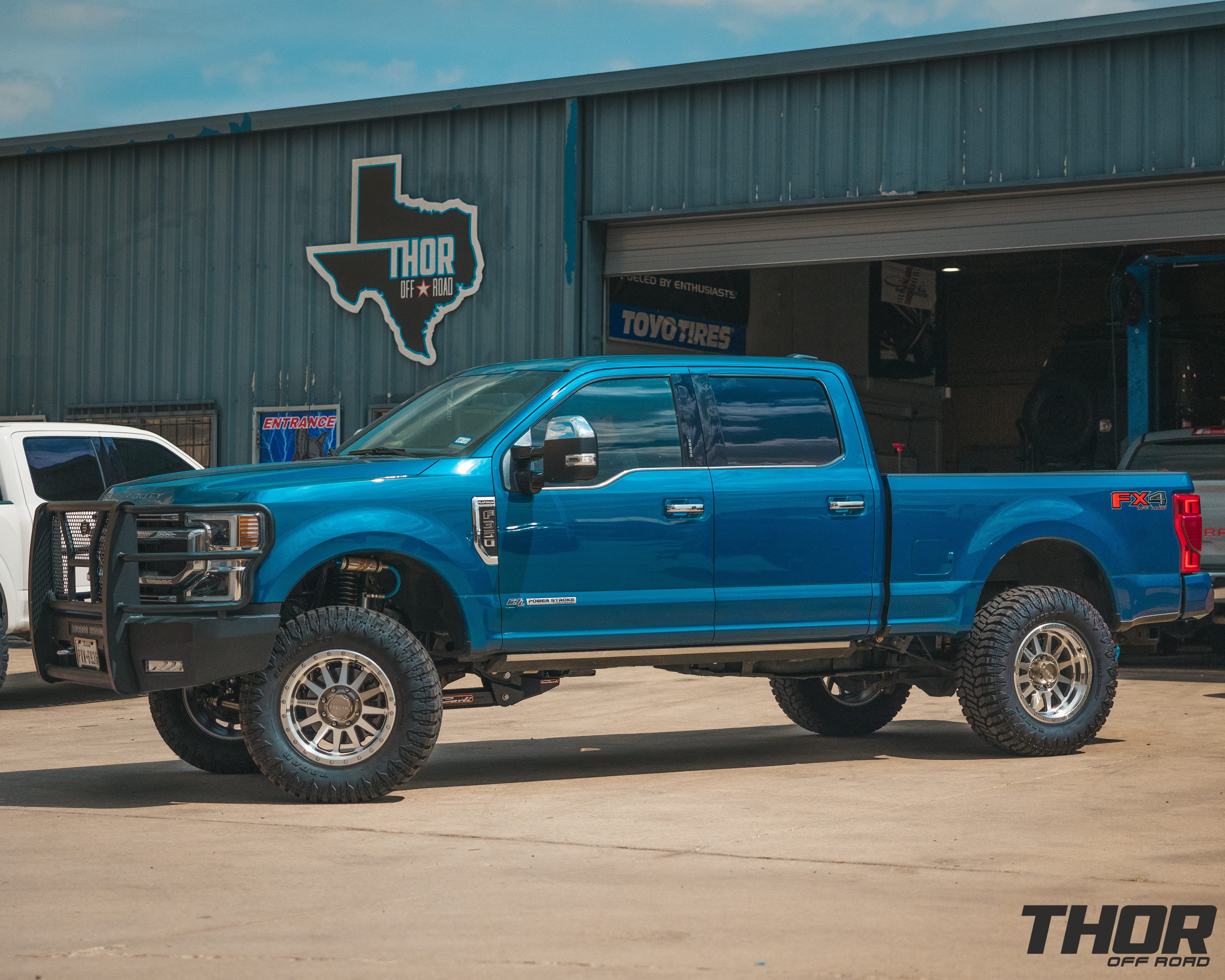2022 Ford F-350 Super Duty Platinum in Atlas Blue with Carli 3.5" King Pintop Suspension Kit, Carli Radius Arms, Carli Torsion Sway Bar, Full Rear Leafs, Steelcraft Front Bumper, 20" Method Machined Standards, 37x13.50R20 Tires