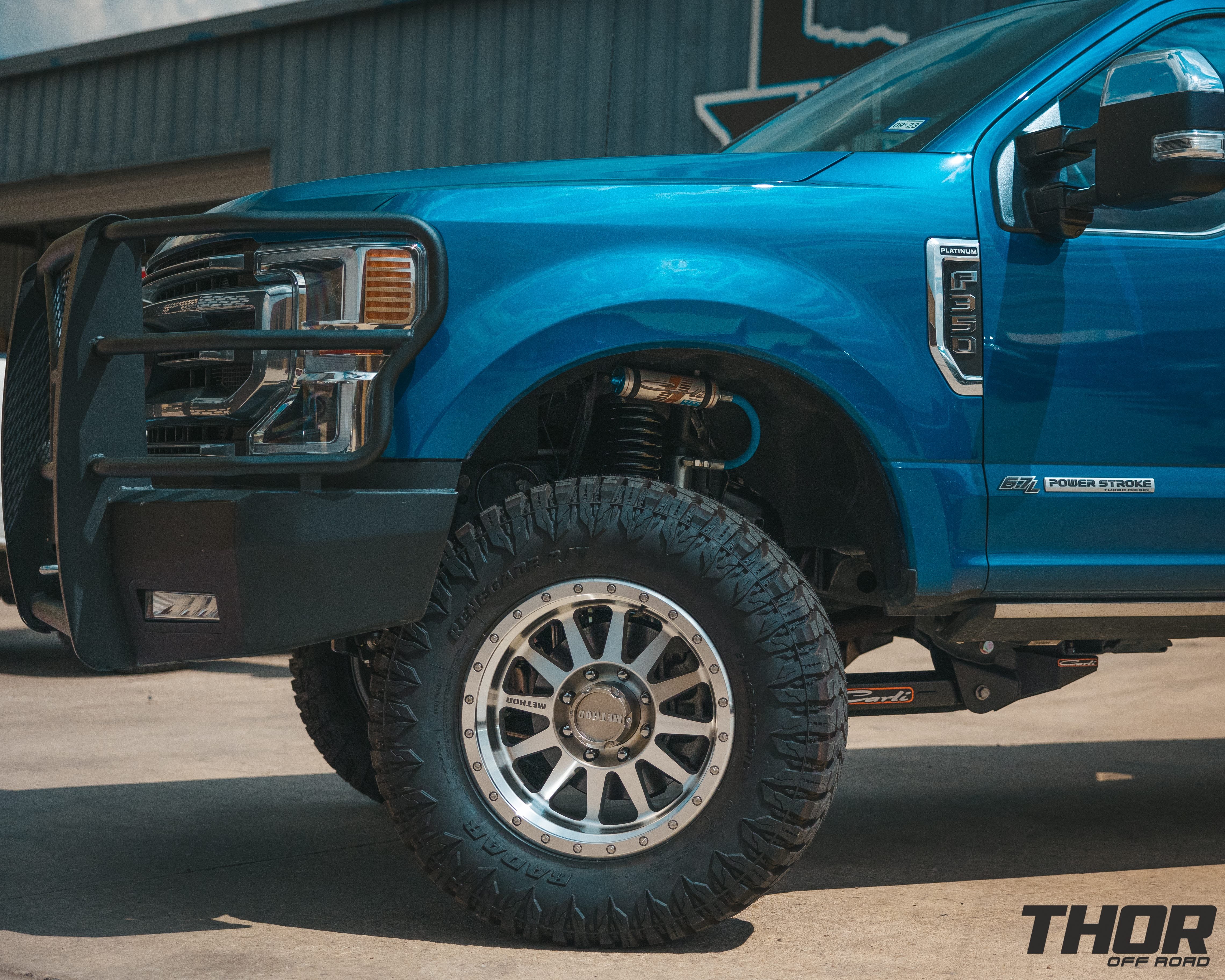 2022 Ford F-350 Super Duty Platinum in Atlas Blue with Carli 3.5" King Pintop Suspension Kit, Carli Radius Arms, Carli Torsion Sway Bar, Full Rear Leafs, Steelcraft Front Bumper, 20" Method Machined Standards, 37x13.50R20 Tires