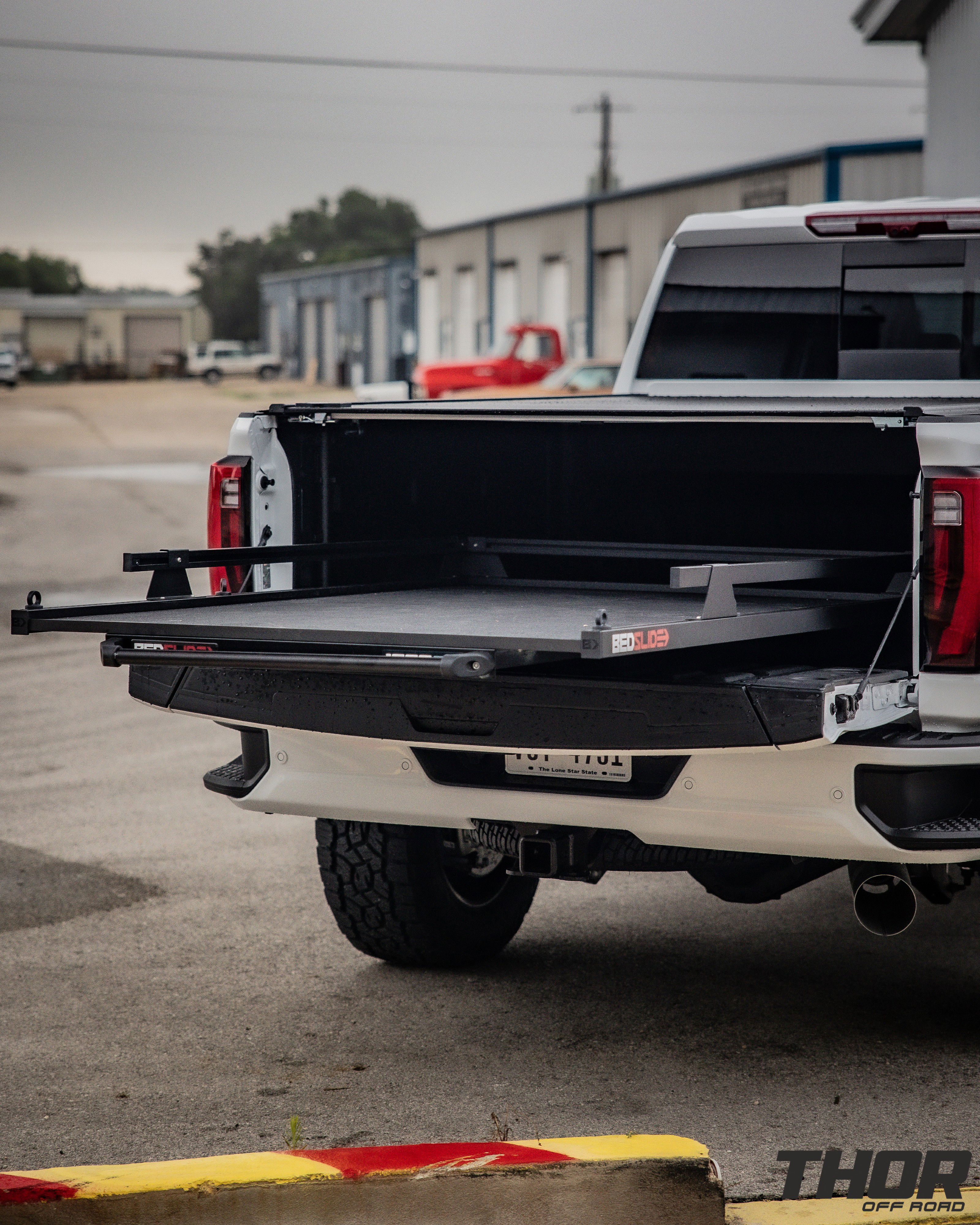 2024 GMC Sierra 2500 HD Denali in White with Cognito 3" Elite Leveling Kit, Toyo Open Country A/T III 35x12.50R20, KG1 DiamondHead 20x9.5" Wheels, Retrax Pro MX Bed Cover, Bedslide Classic