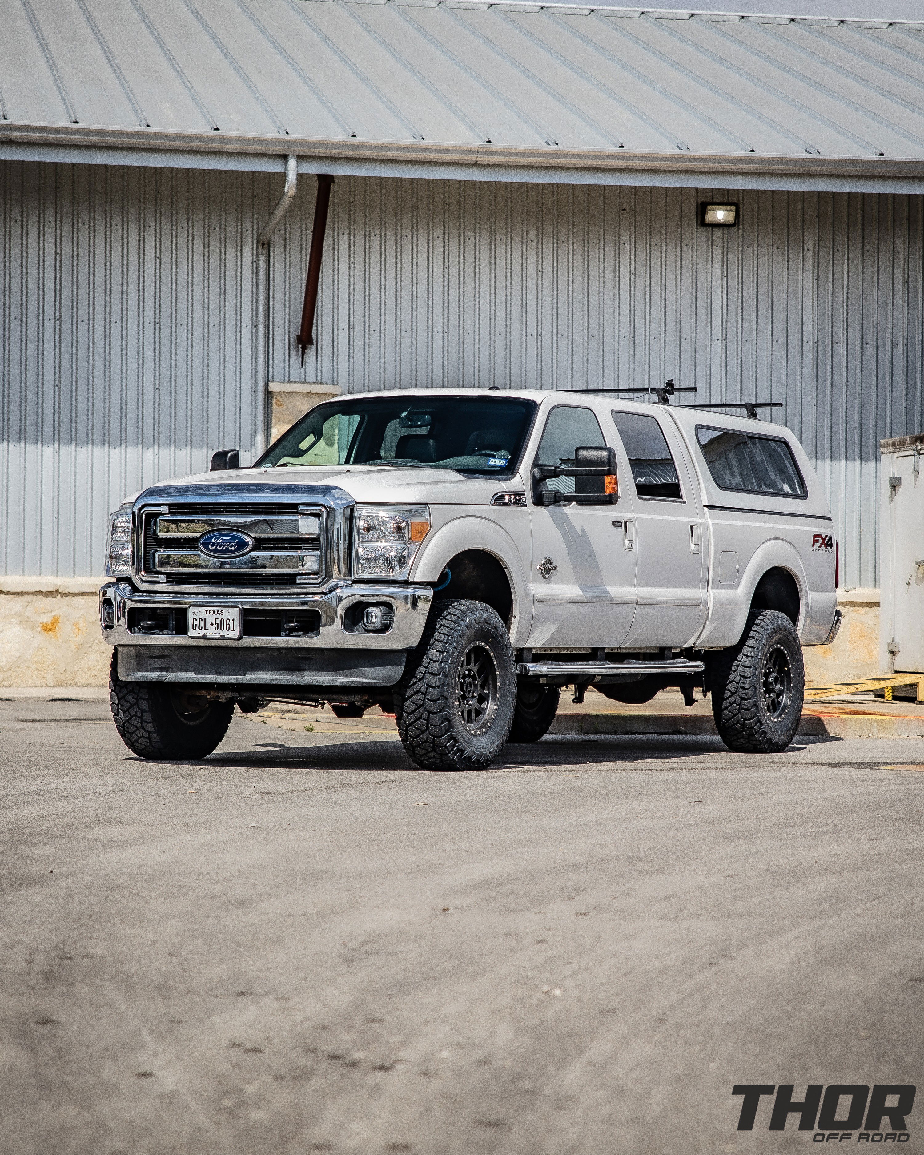 2015 Ford F-250 Super Duty Lariat in White with Carli 5.5" King Pintop Suspension Kit, Carli High Mount Steering Stabilizer, Carli Low Mount Steering Stabilizer, Carli Adjustable Radius Arms, 37x12.50R18 Toyo Open Country R/T Trail Tires