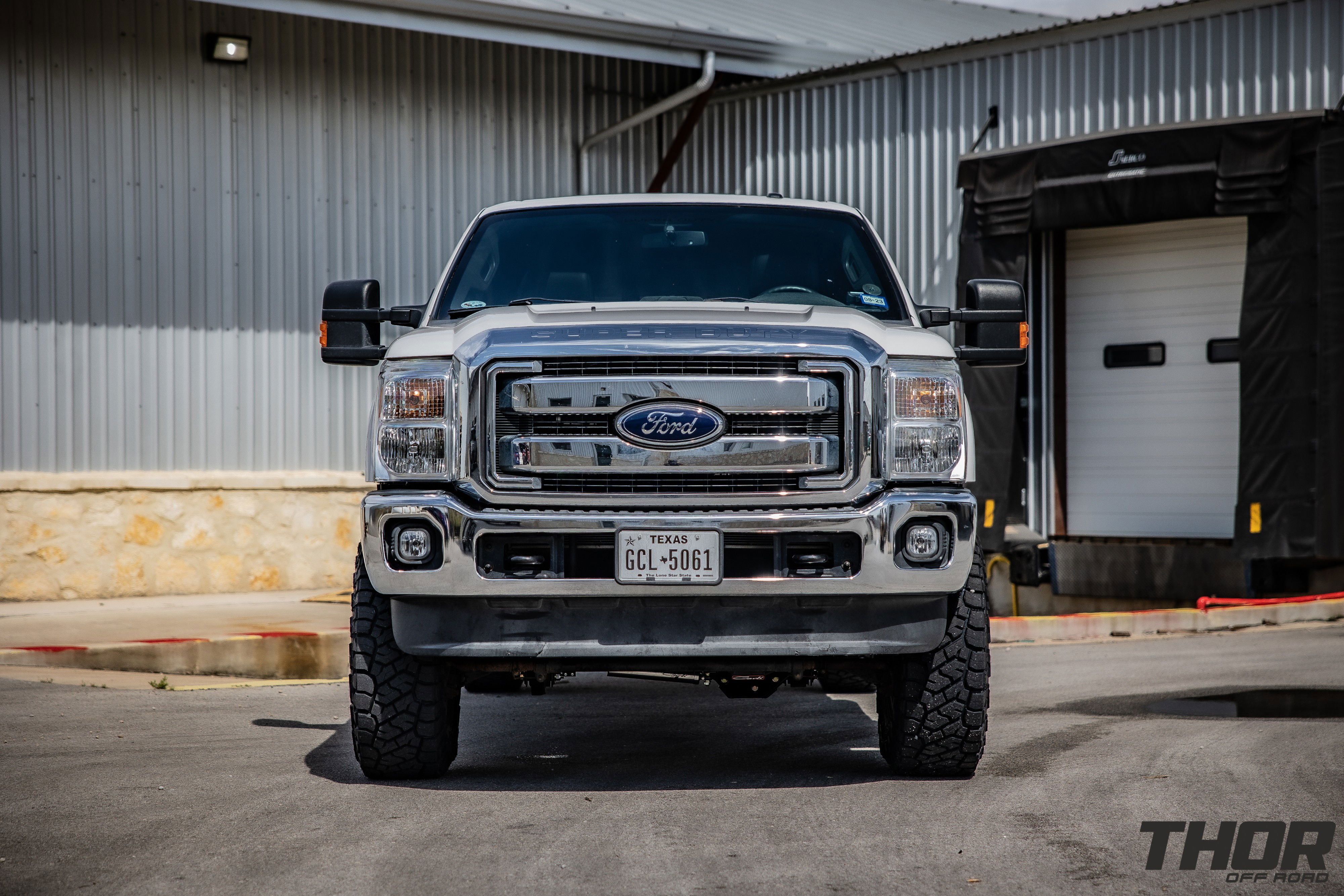 2015 Ford F-250 Super Duty Lariat in White with Carli 5.5" King Pintop Suspension Kit, Carli High Mount Steering Stabilizer, Carli Low Mount Steering Stabilizer, Carli Adjustable Radius Arms, 37x12.50R18 Toyo Open Country R/T Trail Tires