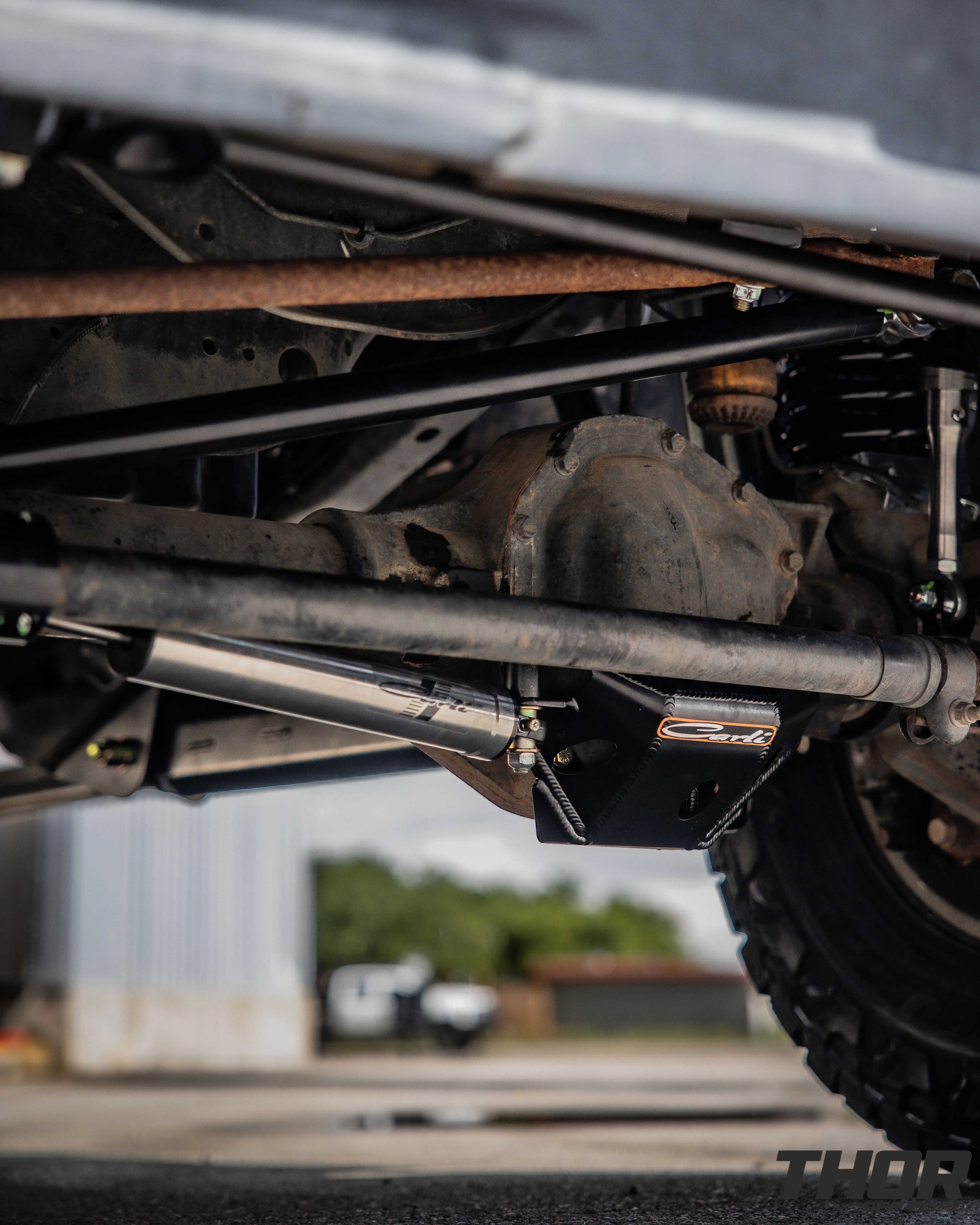 2015 Ford F-250 Super Duty Lariat in White with Carli 5.5" King Pintop Suspension Kit, Carli High Mount Steering Stabilizer, Carli Low Mount Steering Stabilizer, Carli Adjustable Radius Arms, 37x12.50R18 Toyo Open Country R/T Trail Tires