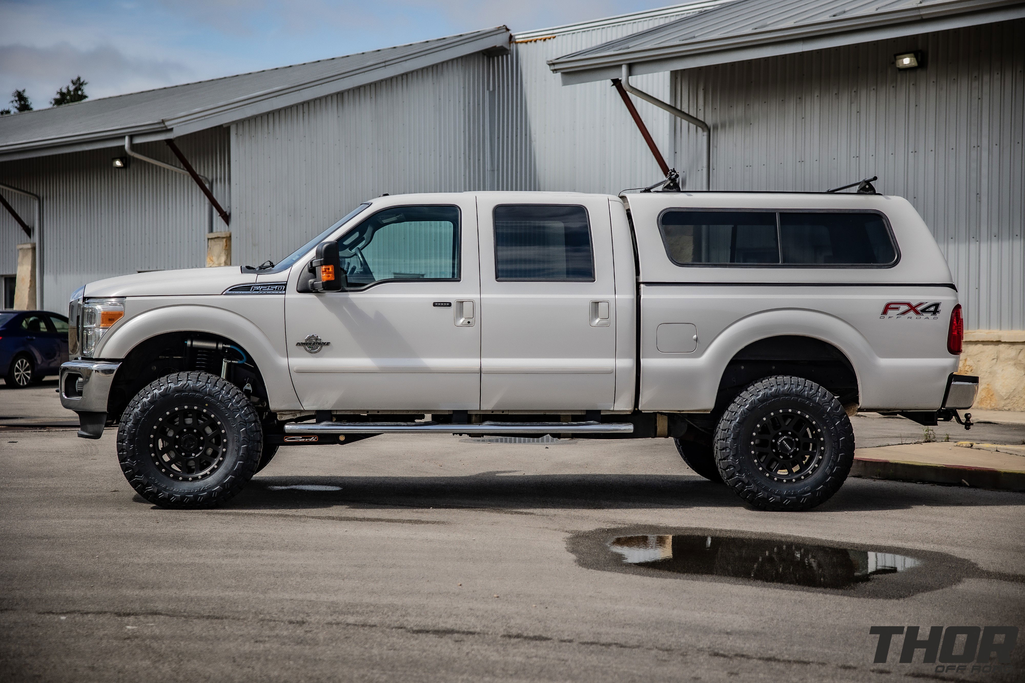 2015 Ford F-250 Super Duty Lariat in White with Carli 5.5" King Pintop Suspension Kit, Carli High Mount Steering Stabilizer, Carli Low Mount Steering Stabilizer, Carli Adjustable Radius Arms, 37x12.50R18 Toyo Open Country R/T Trail Tires