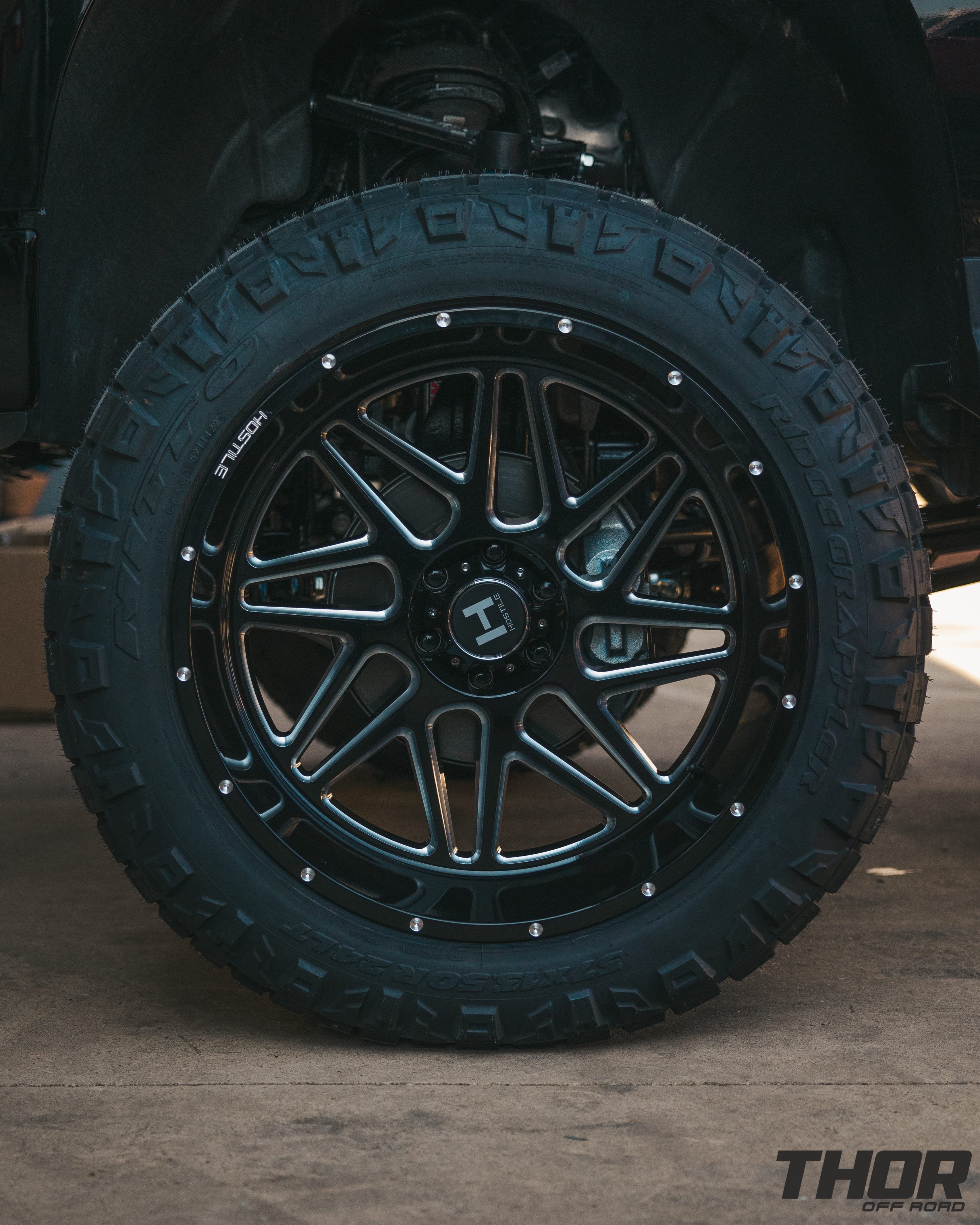 2022 Chevrolet Silverado 1500 LT Trail Boss in Black with McGaughy's 7"-9" Lift Kit, 6x5.5 Hostile H108 Sprocket Wheels, 37x13.50R24 Nitto Ridge Grappler Tires
