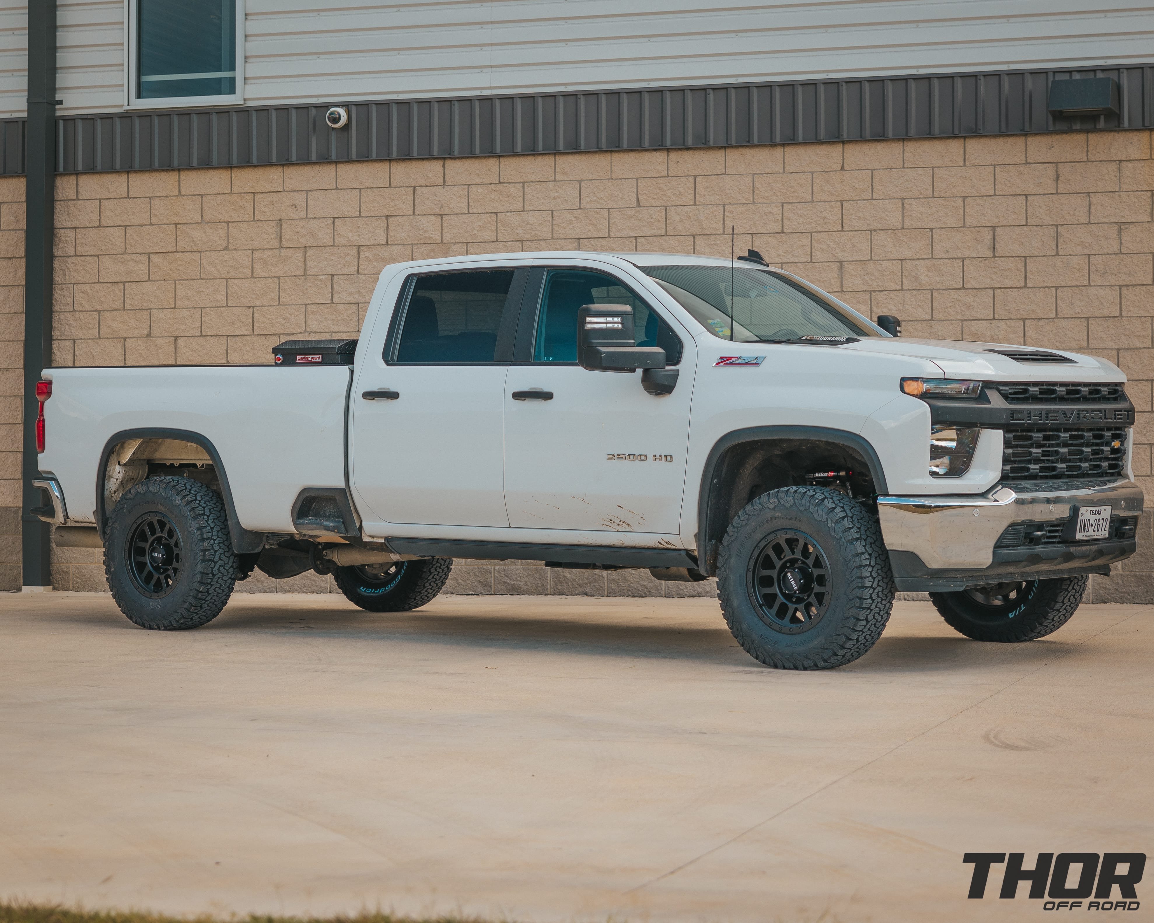 2022 Chevrolet Silverado 2500 HD WT in White with Cognito 3" Elite Suspension Kit with Elka Reservoirs, AMP Research Steps, WeatherGuard Toolbox, Method 18x9" MR309 Matte Black Wheels, 35x12.50R18 BF Goodrich A/T KO2 Tires