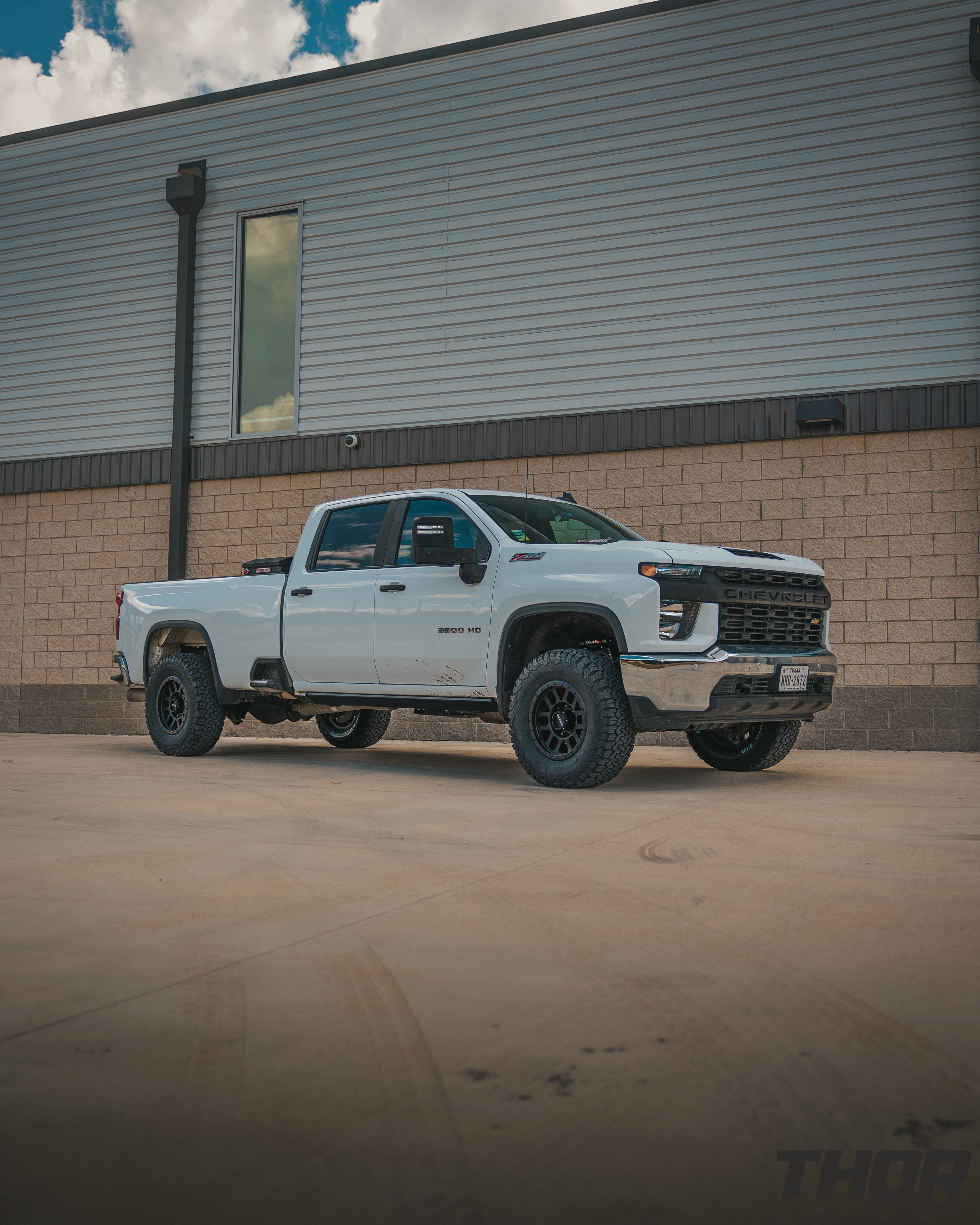 2022 Chevrolet Silverado 2500 HD WT in White with Cognito 3" Elite Suspension Kit with Elka Reservoirs, AMP Research Steps, WeatherGuard Toolbox, Method 18x9" MR309 Matte Black Wheels, 35x12.50R18 BF Goodrich A/T KO2 Tires