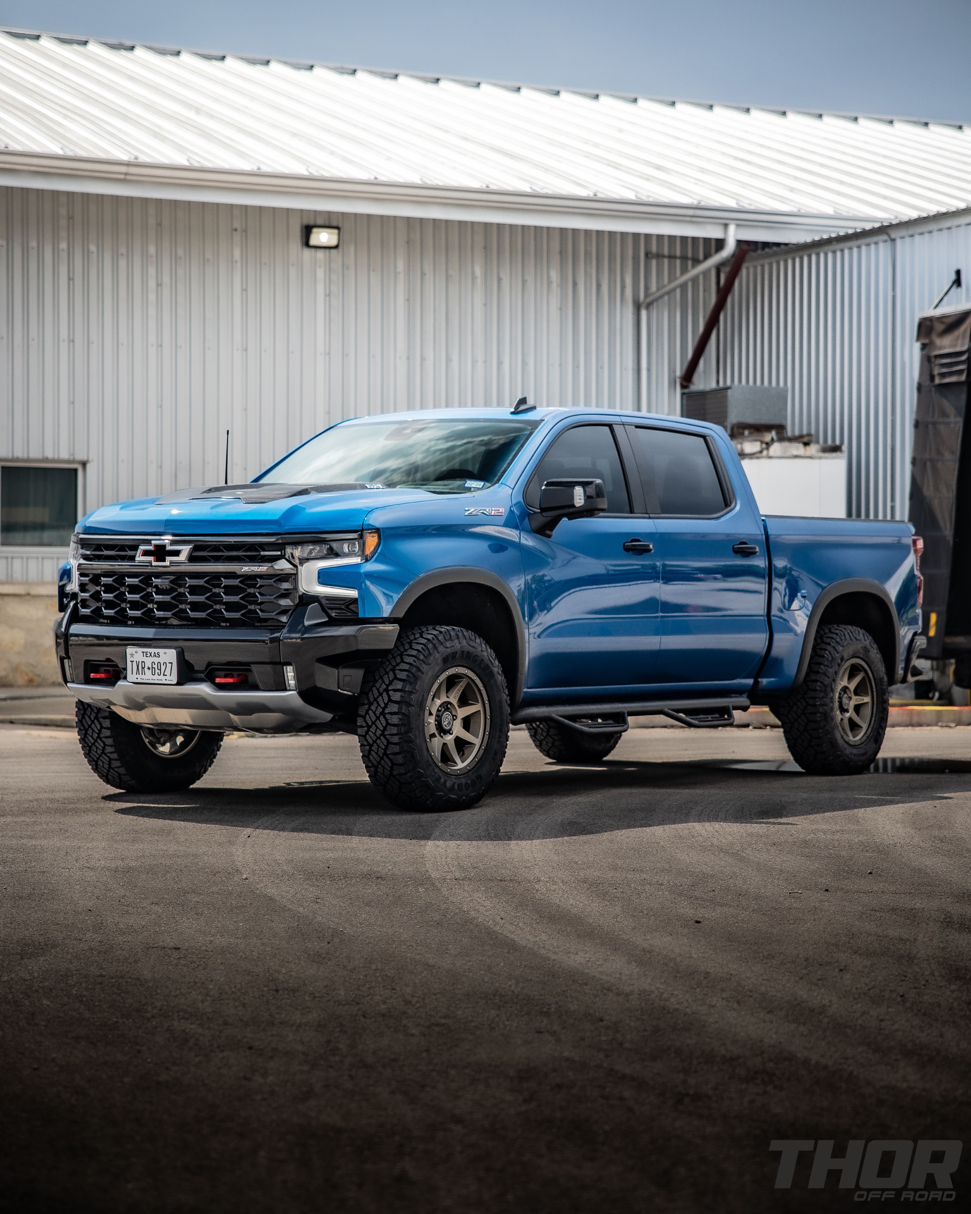 2024 Chevrolet Silverado 1500 ZR2 in Blue with Leveling Kit, Icon Rebound 18x9" Wheels, 295/70R18 Wrangler Duratrac RT Tires, Lomax Bed Cover