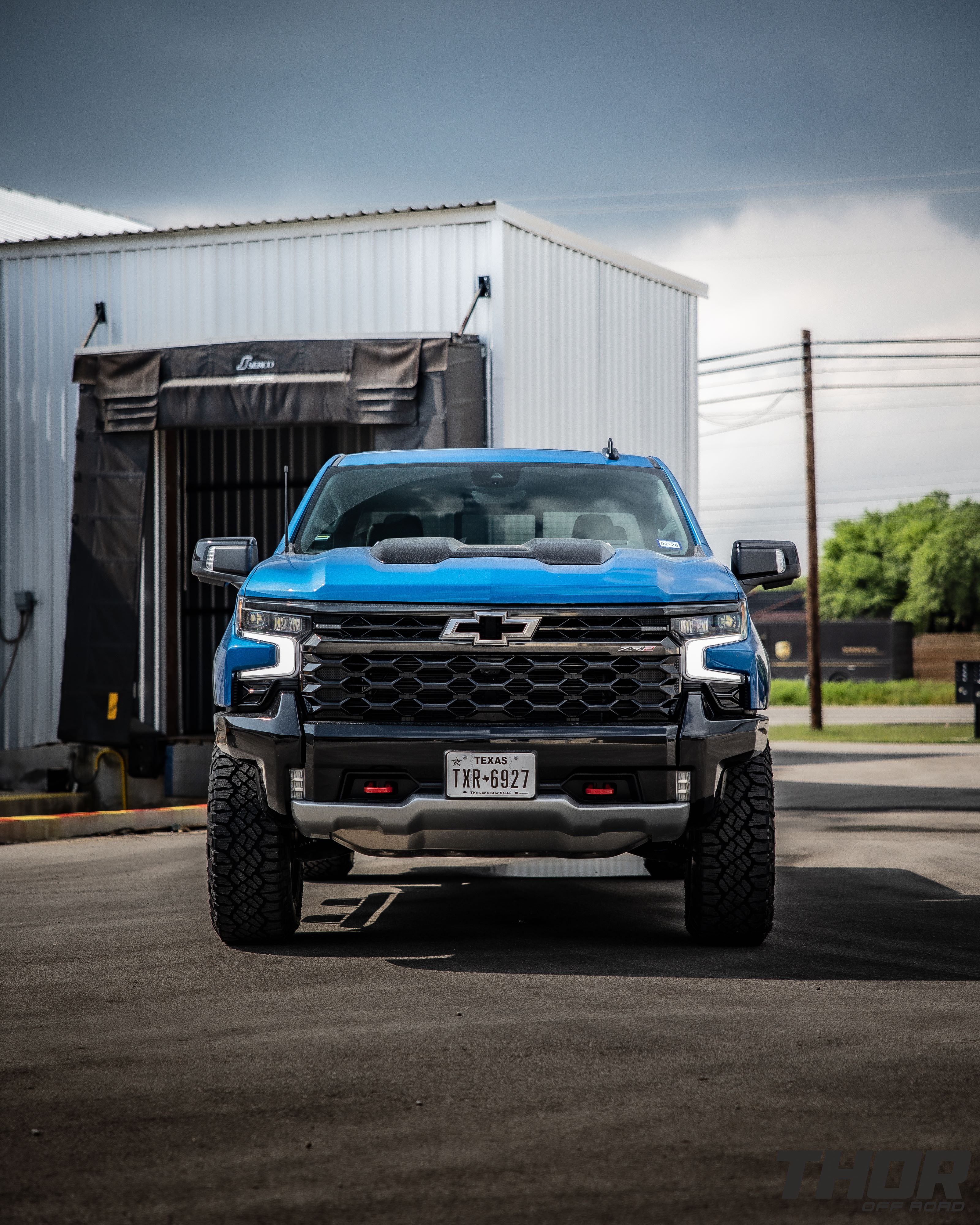 2024 Chevrolet Silverado 1500 ZR2 in Blue with Leveling Kit, Icon Rebound 18x9" Wheels, 295/70R18 Wrangler Duratrac RT Tires, Lomax Bed Cover