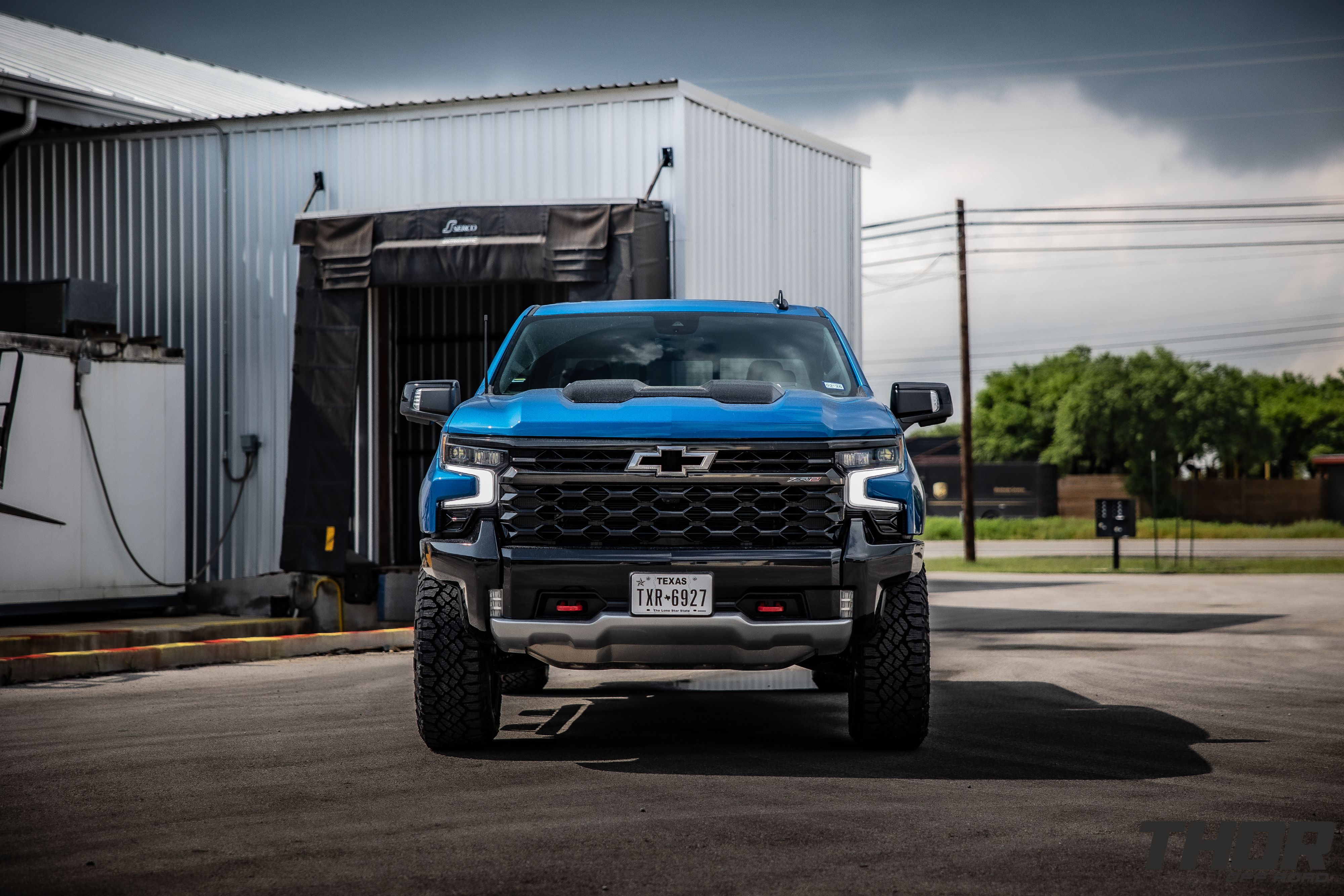 2024 Chevrolet Silverado 1500 ZR2 in Blue with Leveling Kit, Icon Rebound 18x9" Wheels, 295/70R18 Wrangler Duratrac RT Tires, Lomax Bed Cover