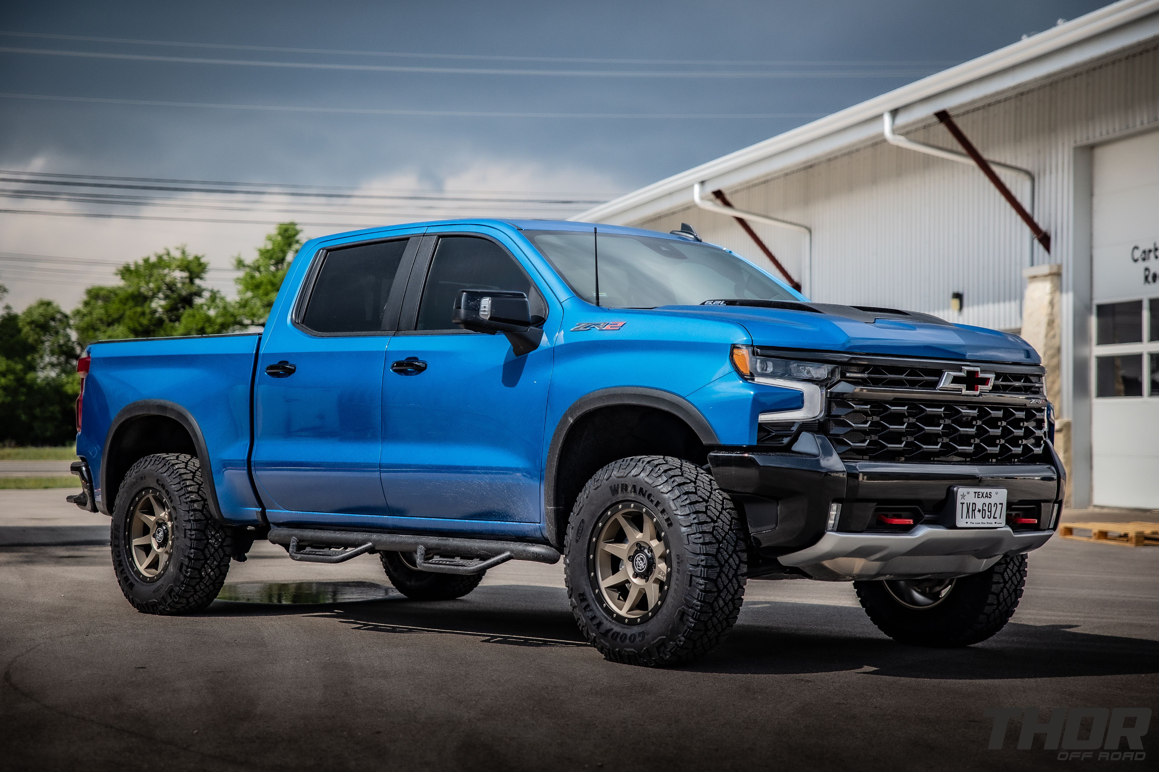 2024 Chevrolet Silverado 1500 ZR2 in Blue with Leveling Kit, Icon Rebound 18x9" Wheels, 295/70R18 Wrangler Duratrac RT Tires, Lomax Bed Cover