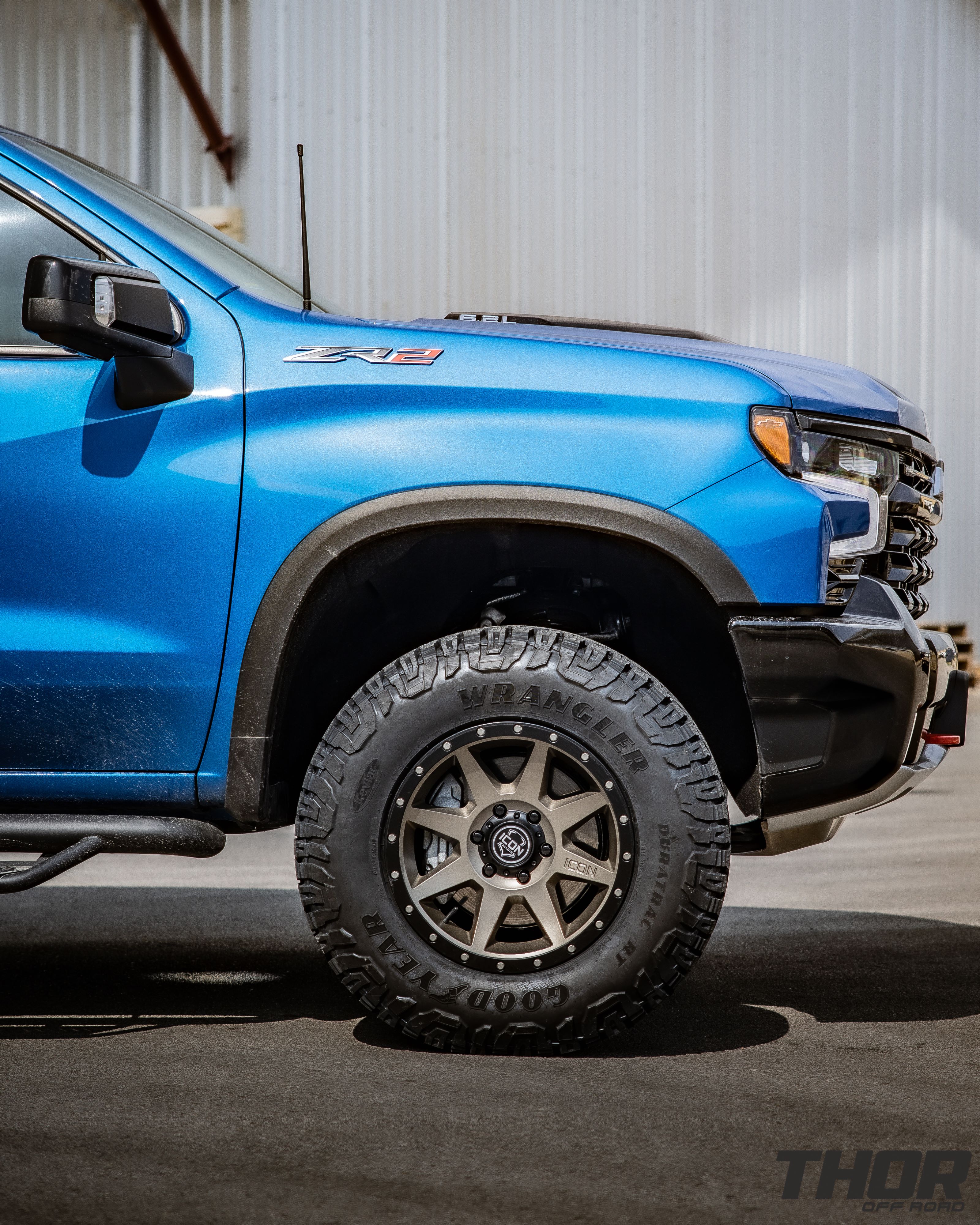 2024 Chevrolet Silverado 1500 ZR2 in Blue with Leveling Kit, Icon Rebound 18x9" Wheels, 295/70R18 Wrangler Duratrac RT Tires, Lomax Bed Cover