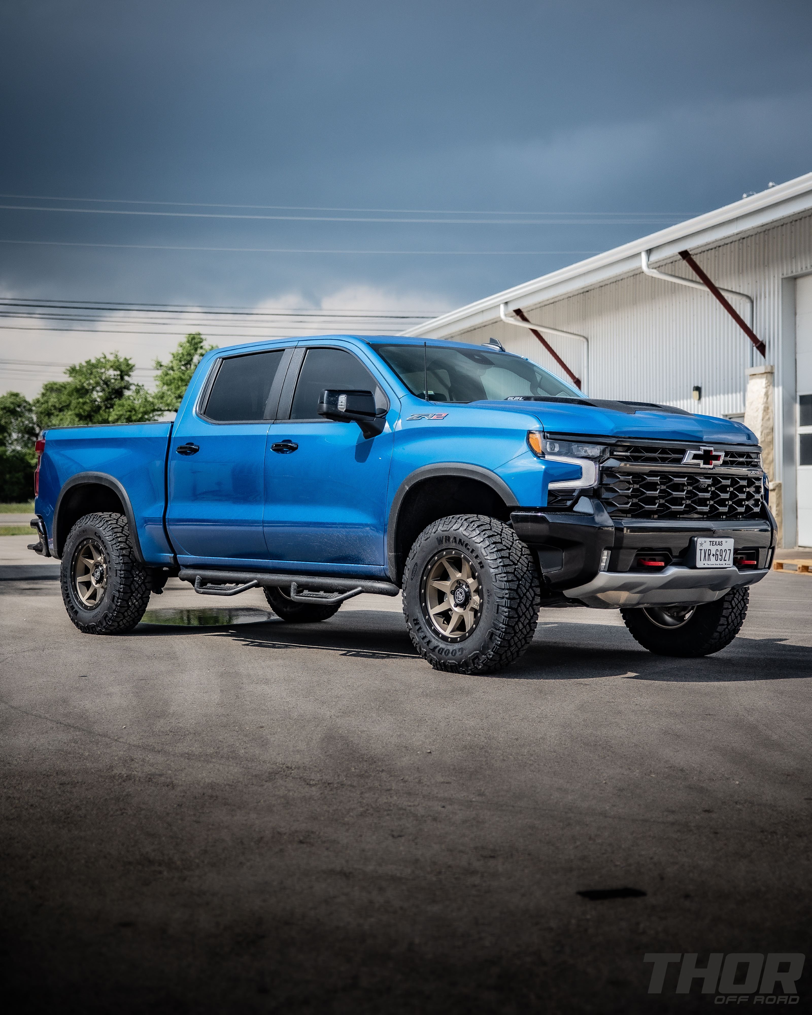 2024 Chevrolet Silverado 1500 ZR2 in Blue with Leveling Kit, Icon Rebound 18x9" Wheels, 295/70R18 Wrangler Duratrac RT Tires, Lomax Bed Cover