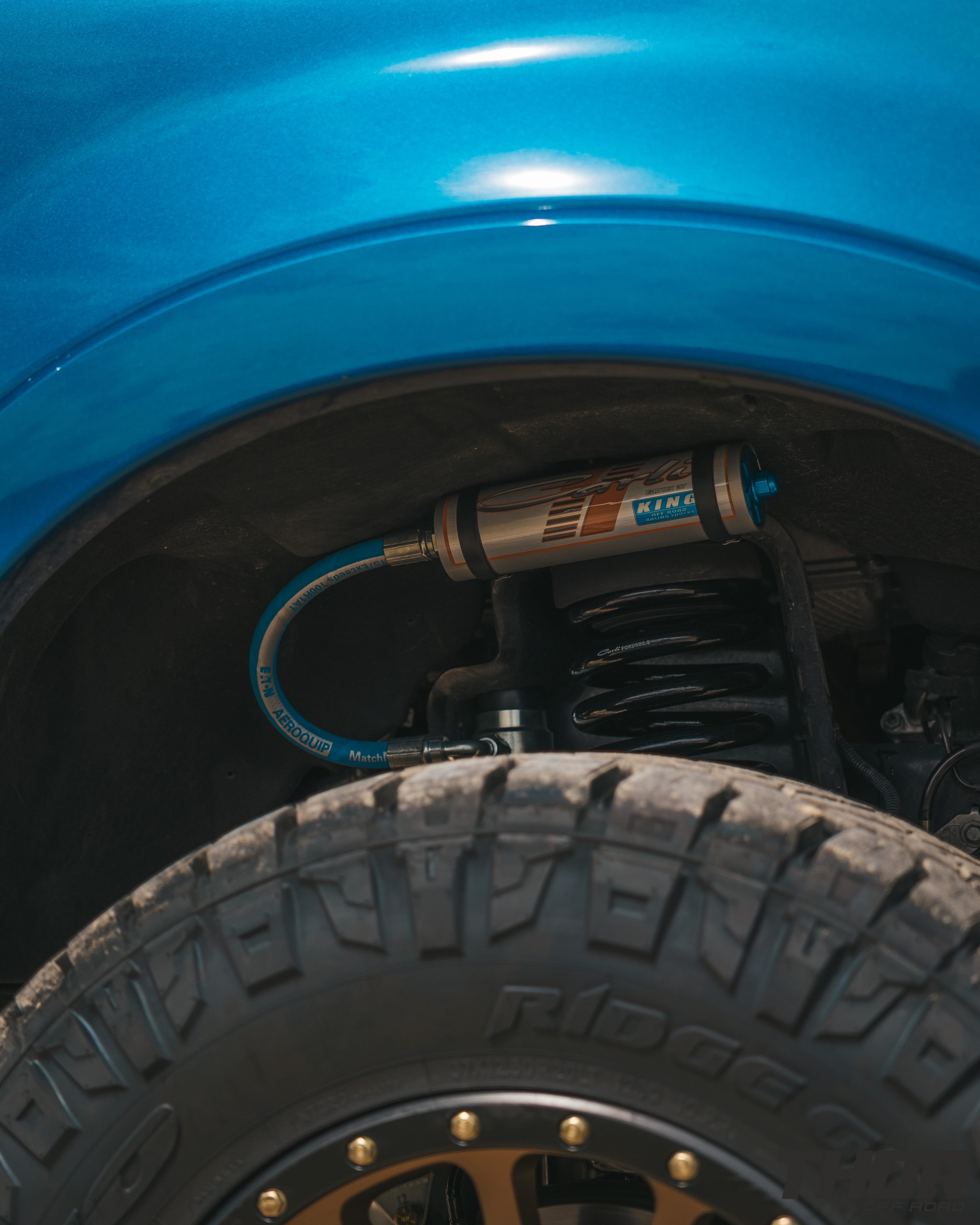 2022 Ford F-250 Super Duty Platinum in Blue with Carli 3.5" Pintop Suspension Kit, Carli Torsion Sway Bar, Carli High Mount Steering Stabilizer, Carli Low Mount Steering Stabilizer, Carli Radius Arms, 20x9" Method 305 NV Bronze Wheels, 37x12.50R20 Nitto Ridge Grappler Tires