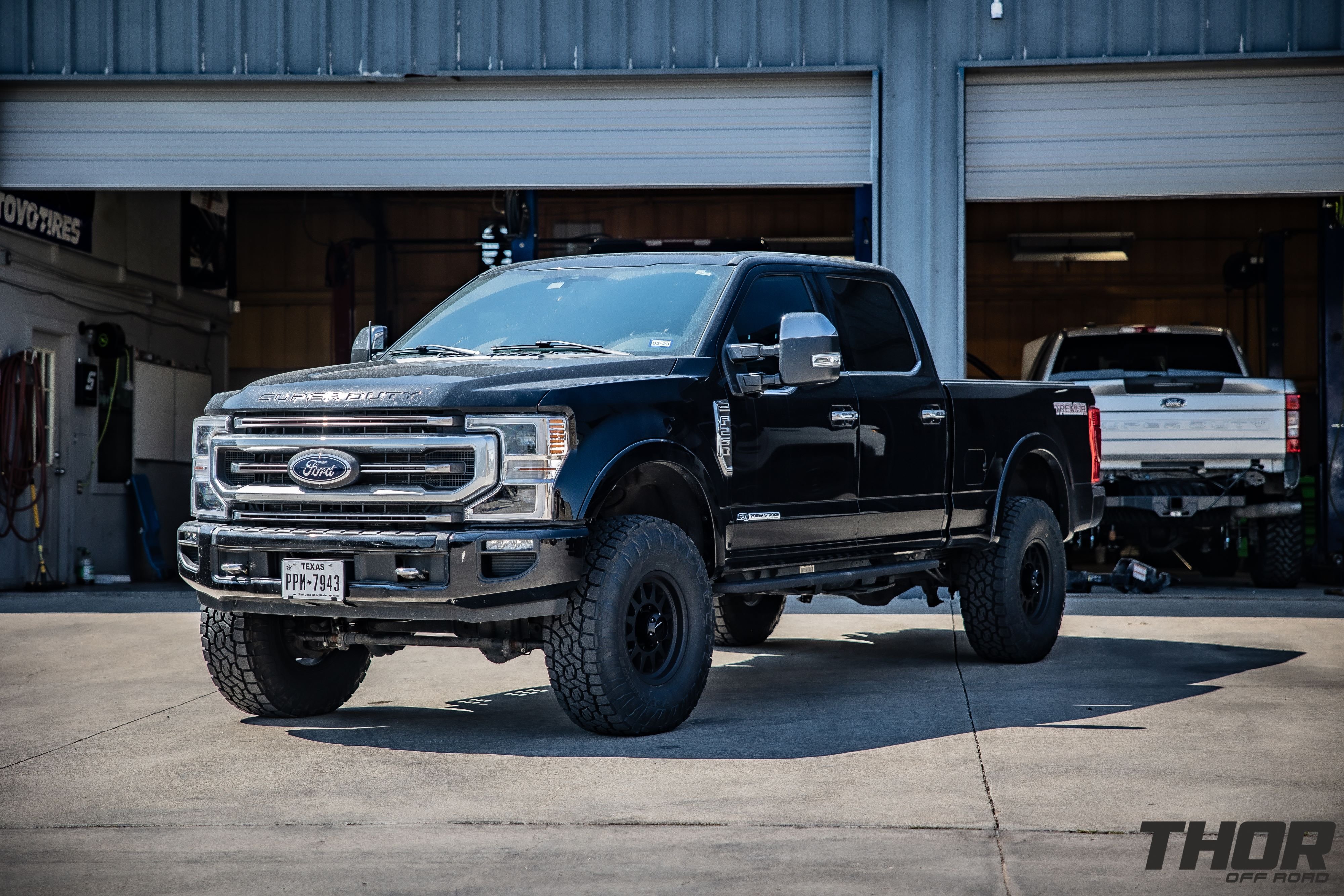 2022 Ford F-250 Super Duty Platinum in Black with Carli Backcountry 3.5" Suspension Kit, Carli High Mount Steering Stabilizer, Carli Torsion Sway Bar, Method MR704 HD 17x9" Bead Grip Wheels, 37x12.50R17 Toyo Open Country A/T III Tires