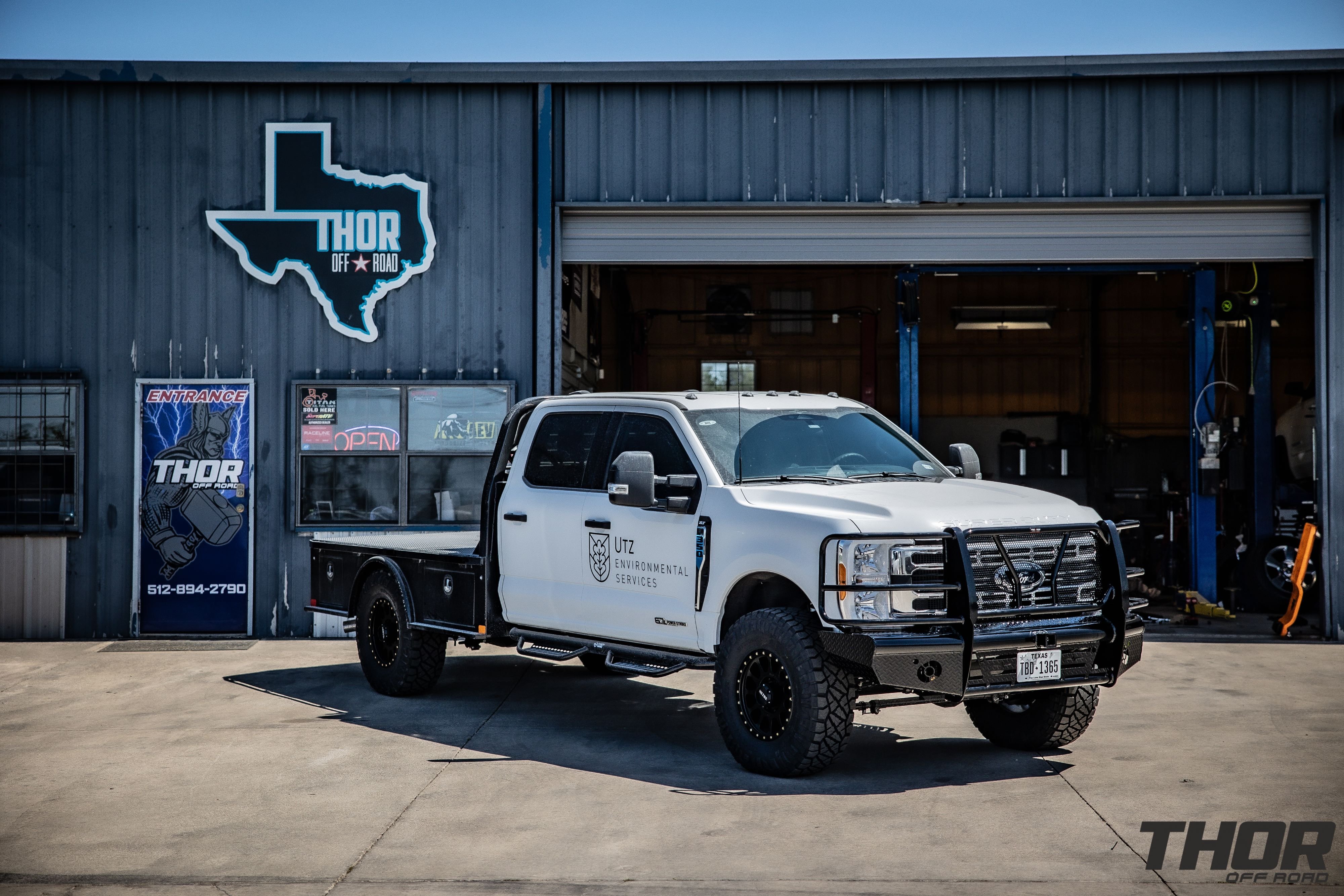 2023 Ford F-350 Super Duty XLT in White with Ready Lift 2.5" Leveling System, 18x9" Method 305 Matte Black Wheels, 35x12.50R18 Nitto Ridge Grappler Tires, Frontier Front Bumper, Air Lift LoadLifter 5000 Ultimate