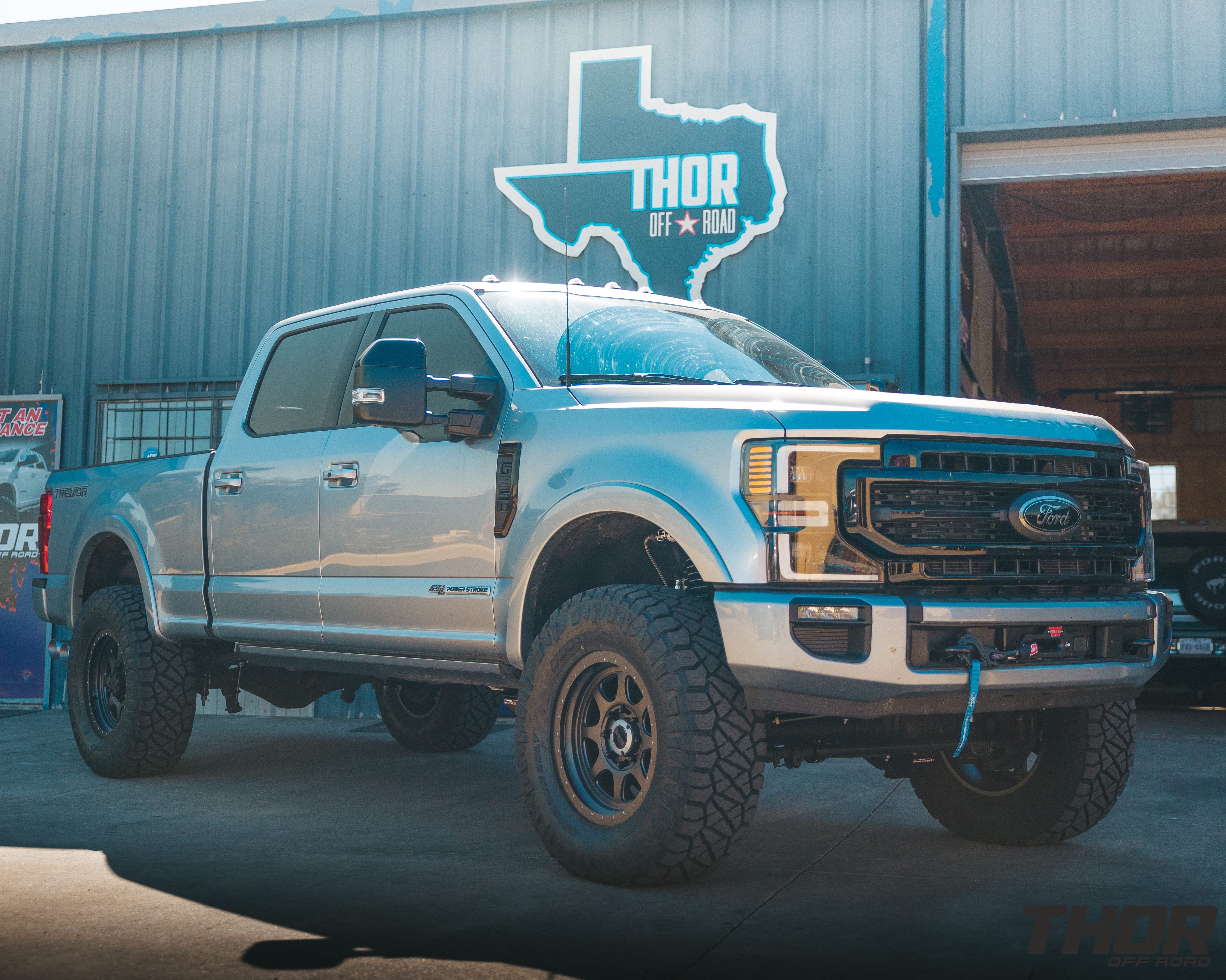 2022 Ford F-350 Super Duty Lariat in Silver with Carli 5.5" Backcountry Suspension Kit, Carli Full Rear Spring Replacement, Carli Long Travel Air Bag Kit, Carli High Mount Steering Stabilizer, Carli Low Mount Steering Stabilizer, Carli Torsion Sway Bar, Carli Radius Arms