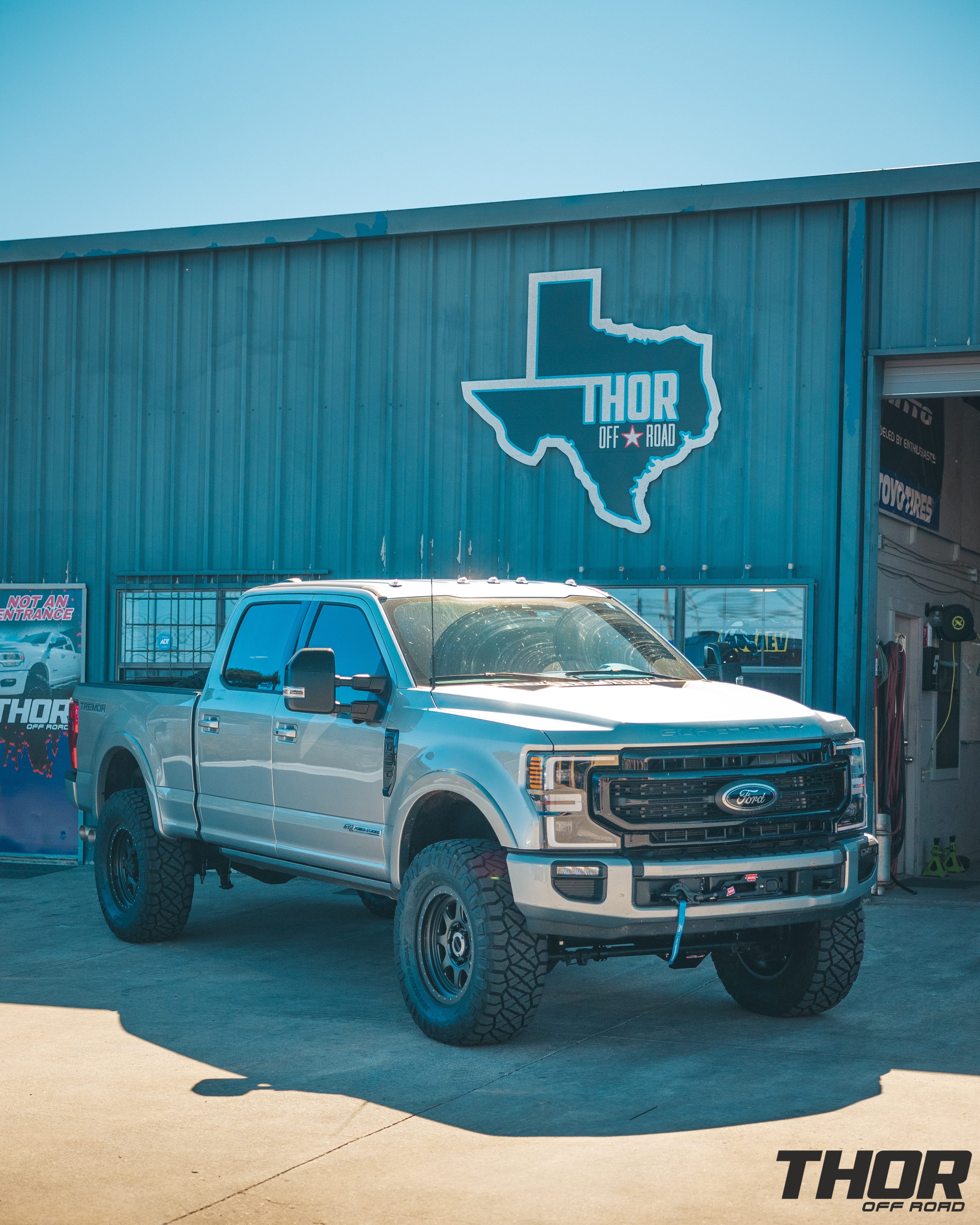 2022 Ford F-350 Super Duty Lariat in Silver with Carli 5.5" Backcountry Suspension Kit, Carli Full Rear Spring Replacement, Carli Long Travel Air Bag Kit, Carli High Mount Steering Stabilizer, Carli Low Mount Steering Stabilizer, Carli Torsion Sway Bar, Carli Radius Arms