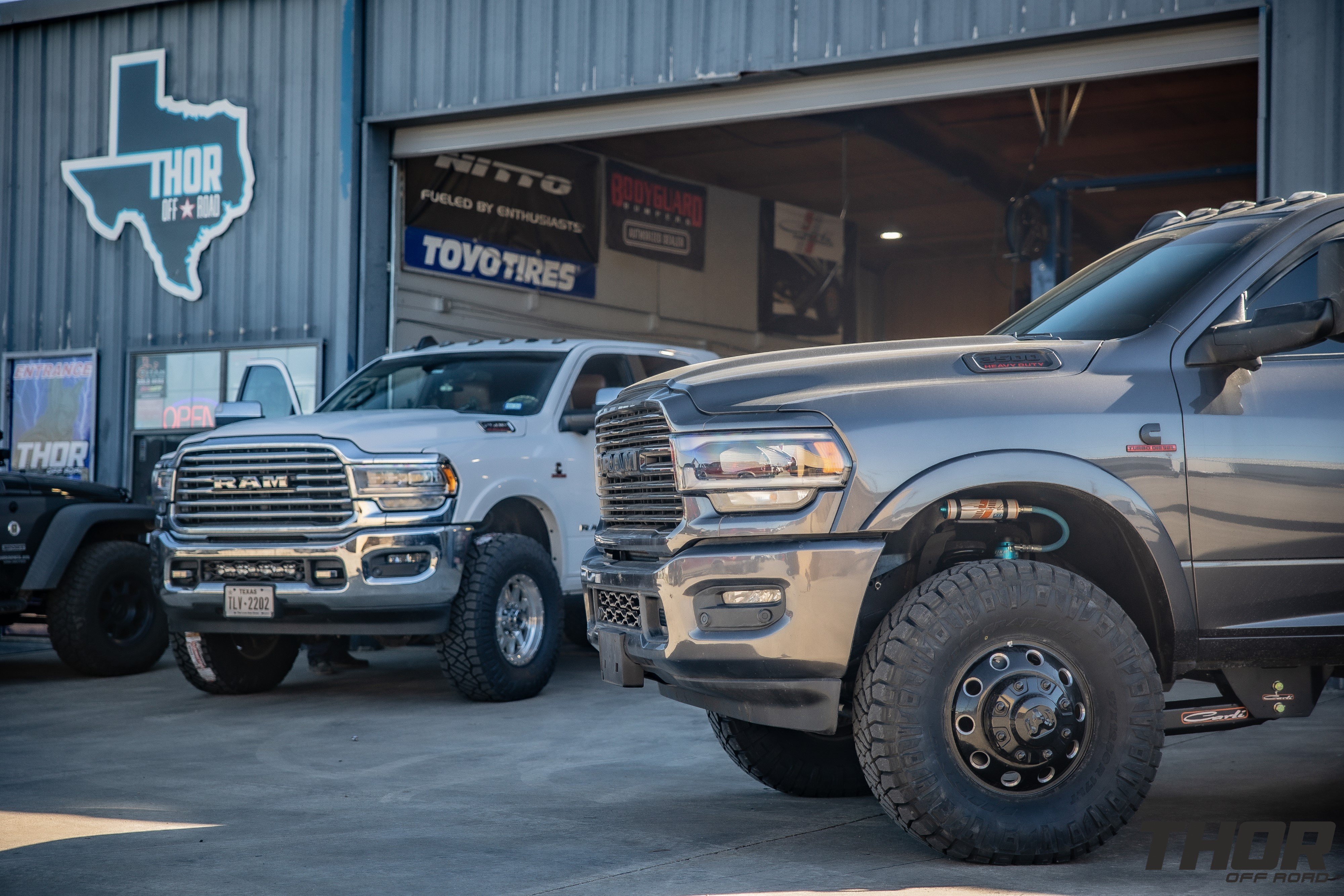 2022 RAM 3500 in Grey with Carli 3" Pintop Suspension System, Carli Fabricated Radius Arms, Carli Low Mount Steering Stabilizer, Carli High Mount Steering Stabilizer, Carli Ball Joints, Carli Add-a-Pack, Air Lift 5000 Load Lifter Kit, 37x12.50R17 Nitto Ridge Grappler Tires
