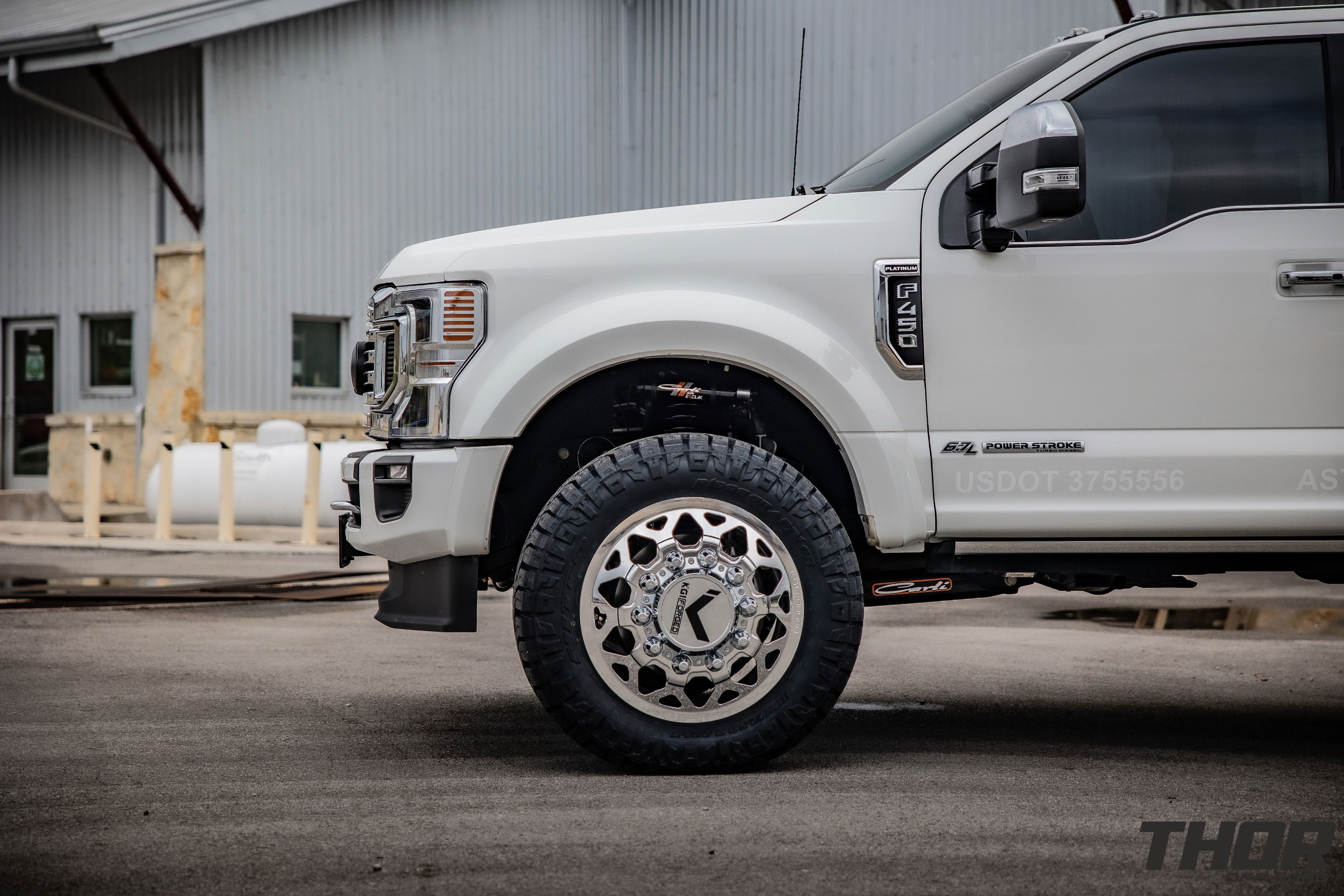 2022 Ford F-450 Super Duty Platinum in White with Carli 3.5" E-Venture Suspension Kit, Carli Sway Bar, Carli Fabricated Radius Arms, Carli Full Rear Spring Replacement, LoadLifter 5000 Air Spring Kit, 22" KG1 Forged KD006 Wheels, 37x12.50R22 Nitto Ridge Grappler Tires