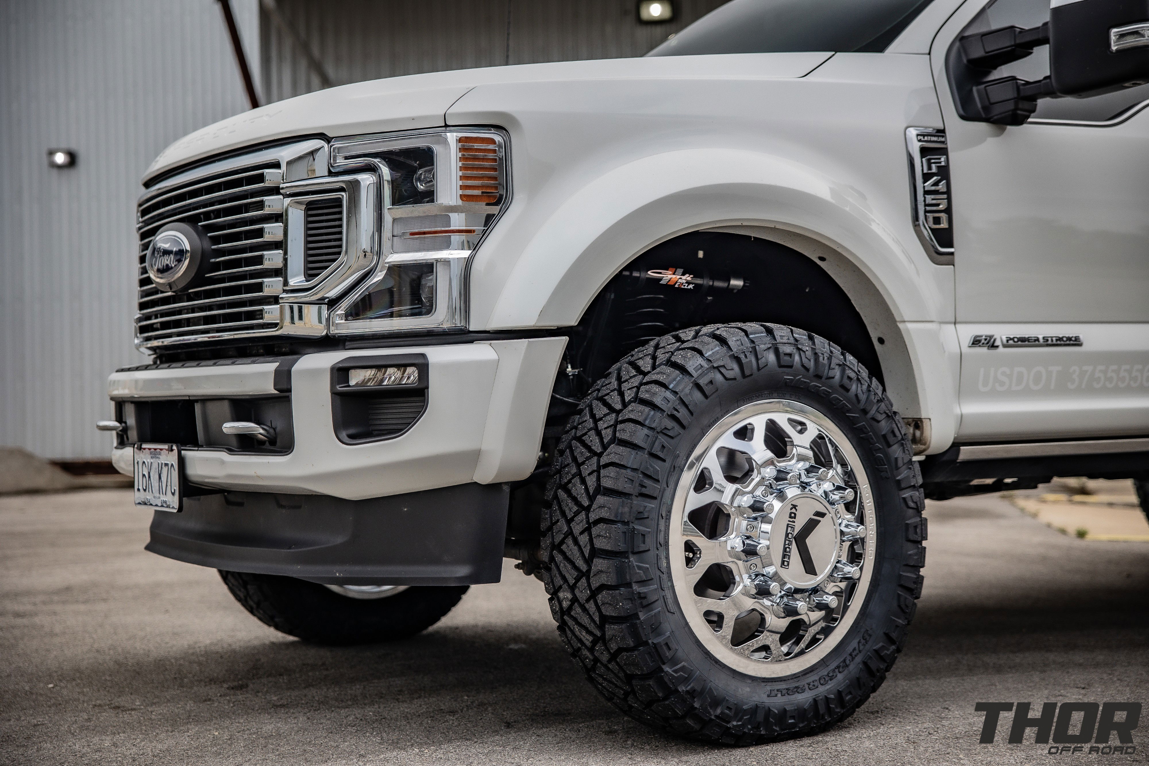 2022 Ford F-450 Super Duty Platinum in White with Carli 3.5" E-Venture Suspension Kit, Carli Sway Bar, Carli Fabricated Radius Arms, Carli Full Rear Spring Replacement, LoadLifter 5000 Air Spring Kit, 22" KG1 Forged KD006 Wheels, 37x12.50R22 Nitto Ridge Grappler Tires