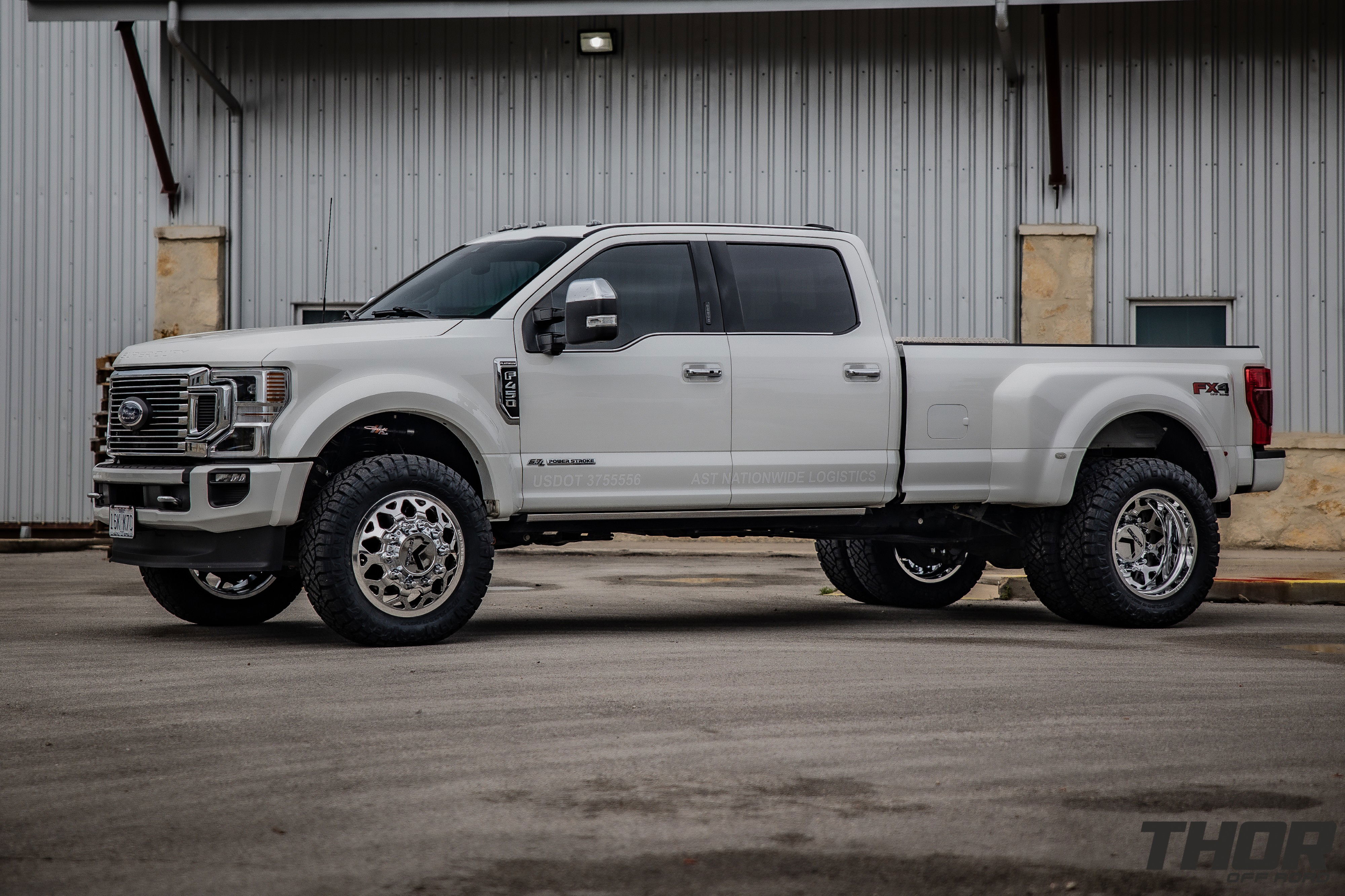 2022 Ford F-450 Super Duty Platinum in White with Carli 3.5" E-Venture Suspension Kit, Carli Sway Bar, Carli Fabricated Radius Arms, Carli Full Rear Spring Replacement, LoadLifter 5000 Air Spring Kit, 22" KG1 Forged KD006 Wheels, 37x12.50R22 Nitto Ridge Grappler Tires