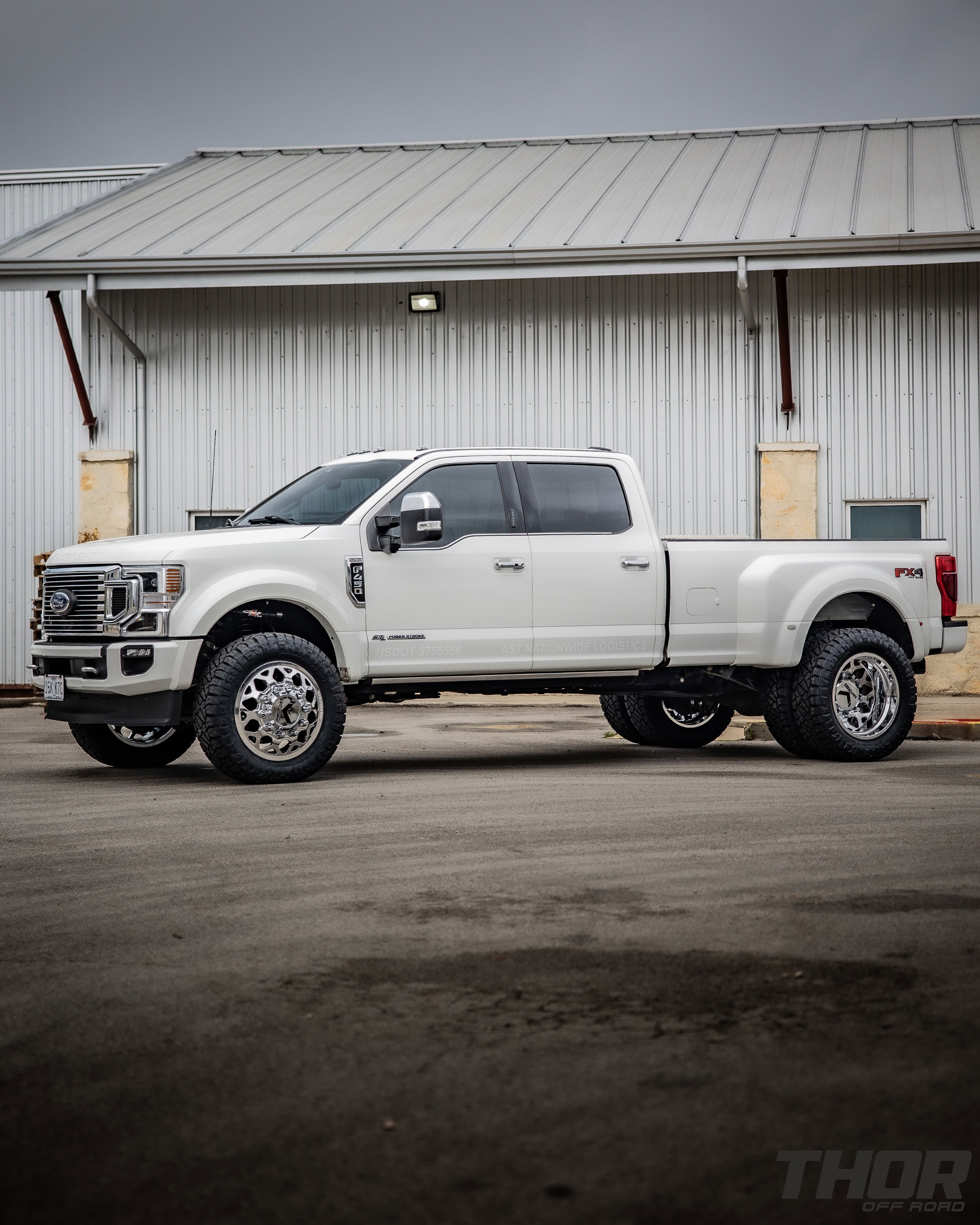 2022 Ford F-450 Super Duty Platinum in White with Carli 3.5" E-Venture Suspension Kit, Carli Sway Bar, Carli Fabricated Radius Arms, Carli Full Rear Spring Replacement, LoadLifter 5000 Air Spring Kit, 22" KG1 Forged KD006 Wheels, 37x12.50R22 Nitto Ridge Grappler Tires