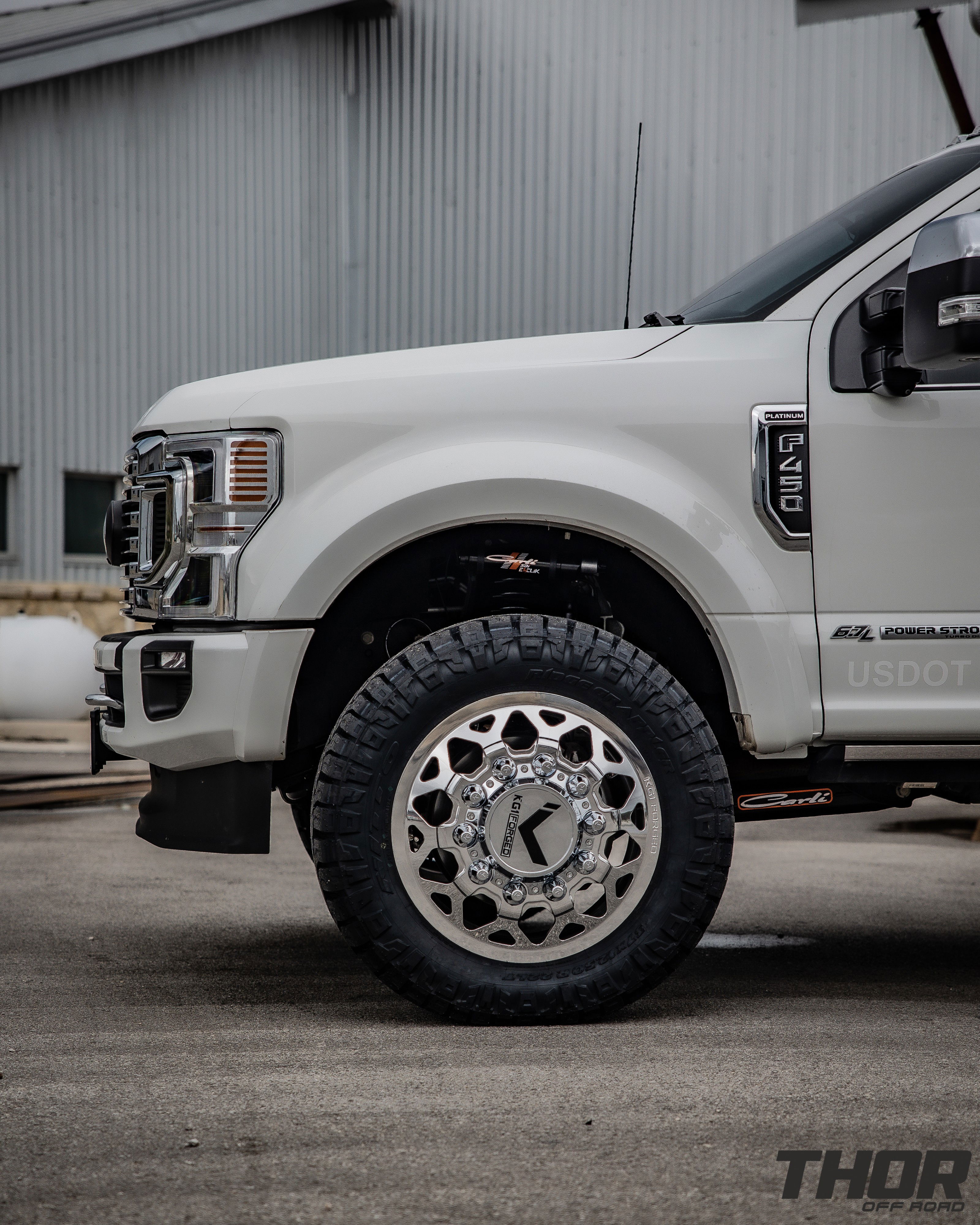 2022 Ford F-450 Super Duty Platinum in White with Carli 3.5" E-Venture Suspension Kit, Carli Sway Bar, Carli Fabricated Radius Arms, Carli Full Rear Spring Replacement, LoadLifter 5000 Air Spring Kit, 22" KG1 Forged KD006 Wheels, 37x12.50R22 Nitto Ridge Grappler Tires