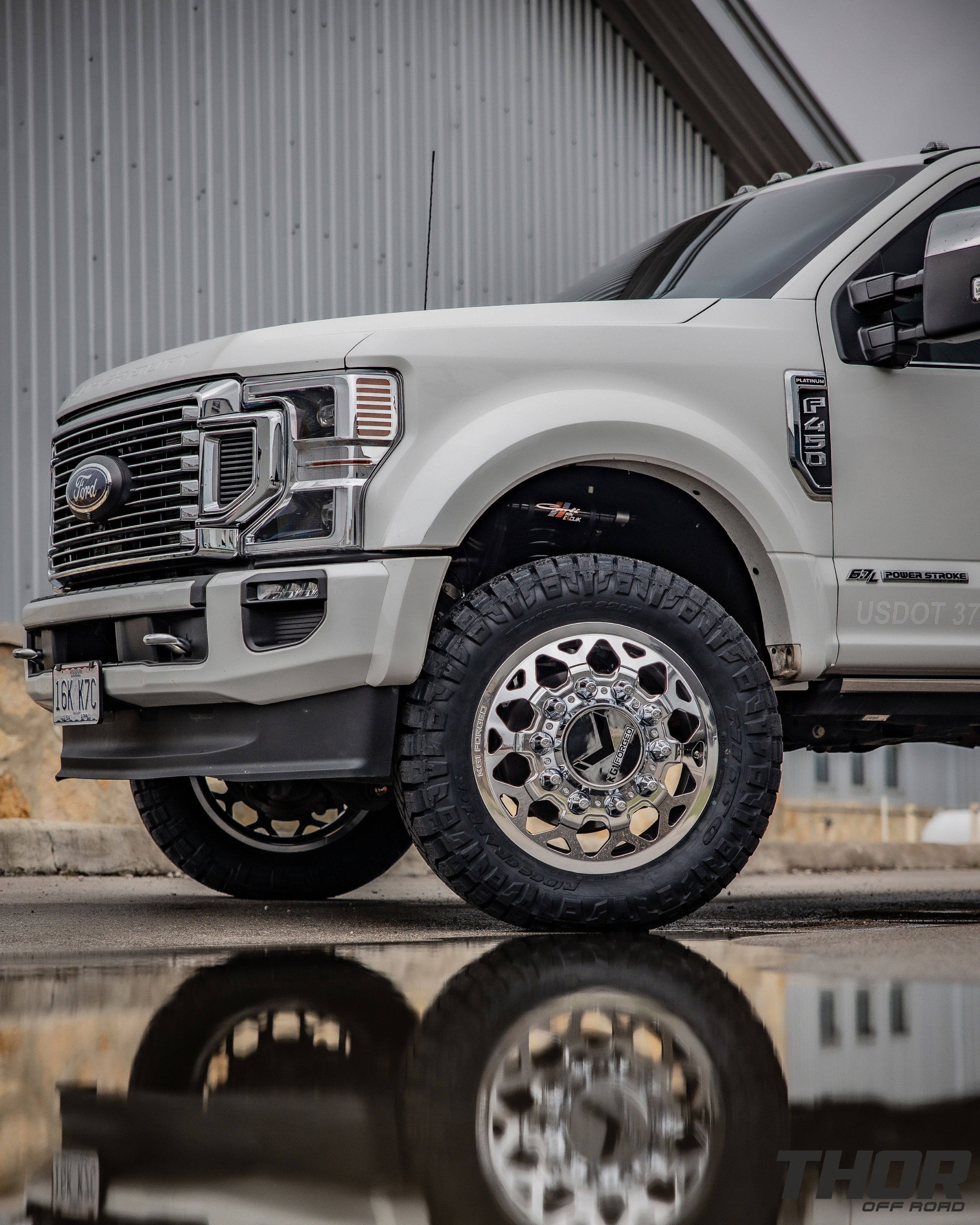 2022 Ford F-450 Super Duty Platinum in White with Carli 3.5" E-Venture Suspension Kit, Carli Sway Bar, Carli Fabricated Radius Arms, Carli Full Rear Spring Replacement, LoadLifter 5000 Air Spring Kit, 22" KG1 Forged KD006 Wheels, 37x12.50R22 Nitto Ridge Grappler Tires