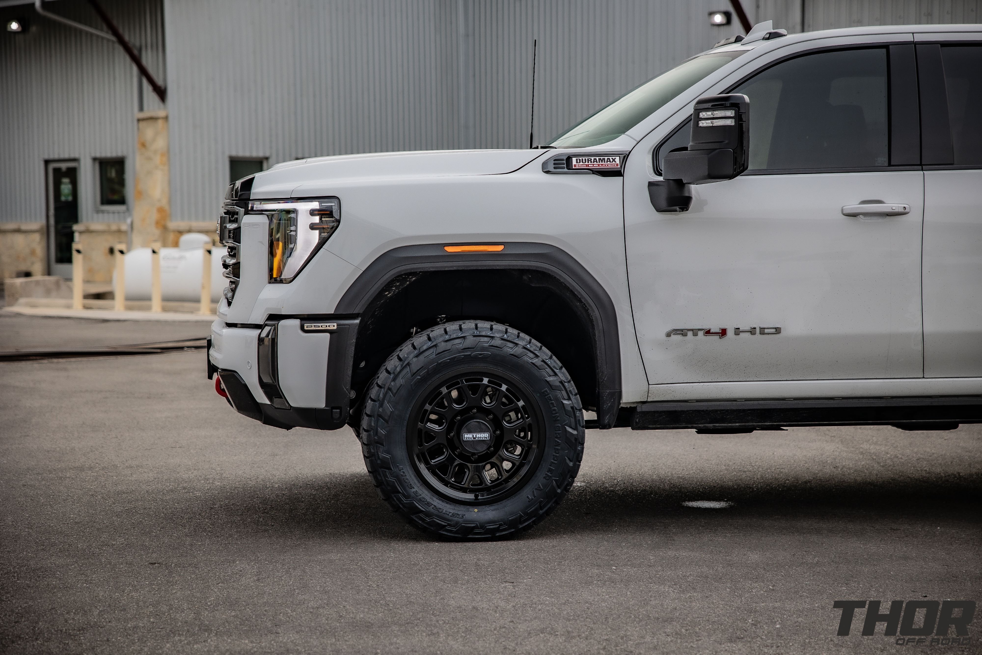 2024 GMC Sierra 2500 HD AT4 in White with Cognito 3" Leveling Kit, Method MR321 20x9" Wheels, 35x12.50R20 Nitto Recon Grappler A/T Tires