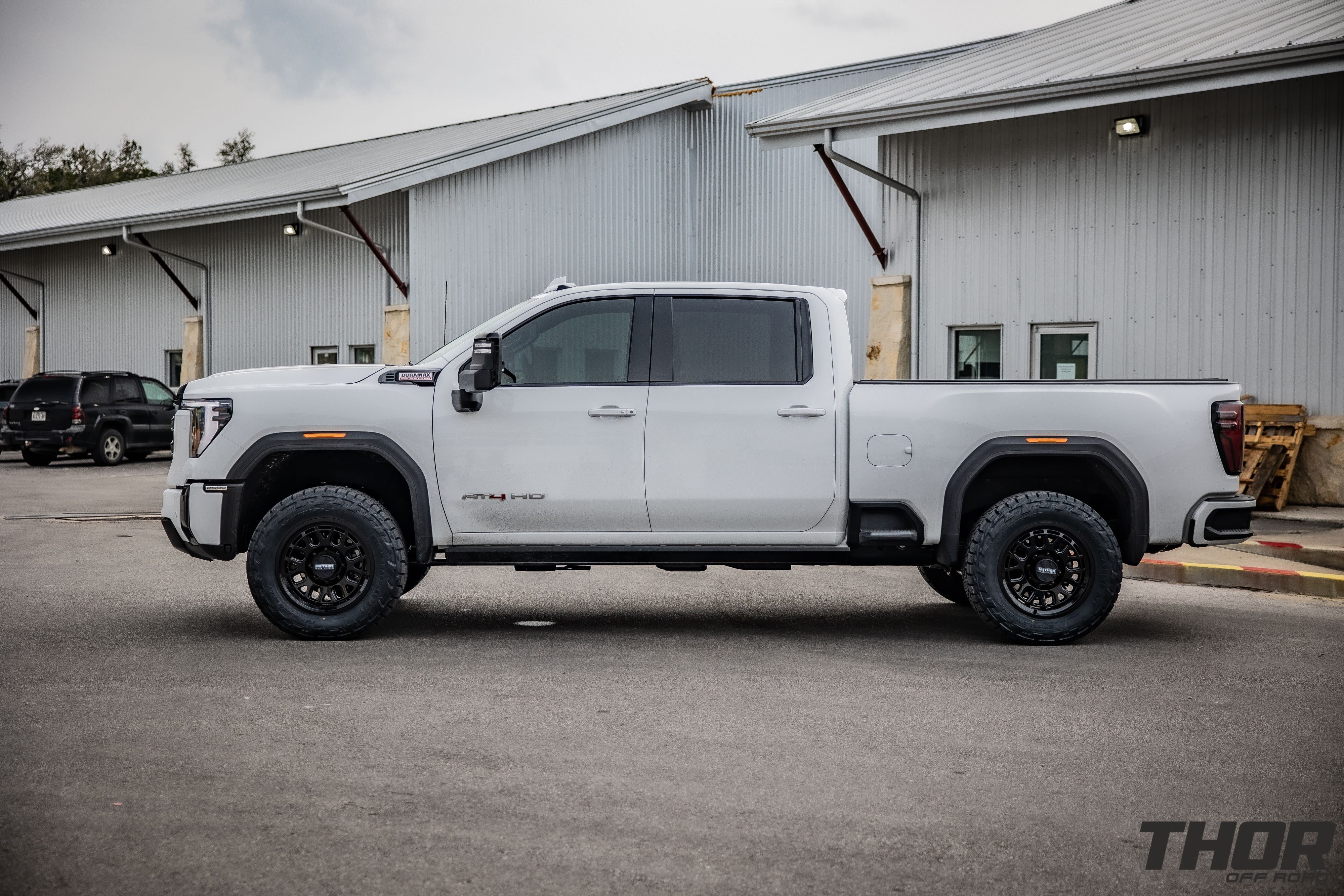 2024 GMC Sierra 2500 HD AT4 in White with Cognito 3" Leveling Kit, Method MR321 20x9" Wheels, 35x12.50R20 Nitto Recon Grappler A/T Tires