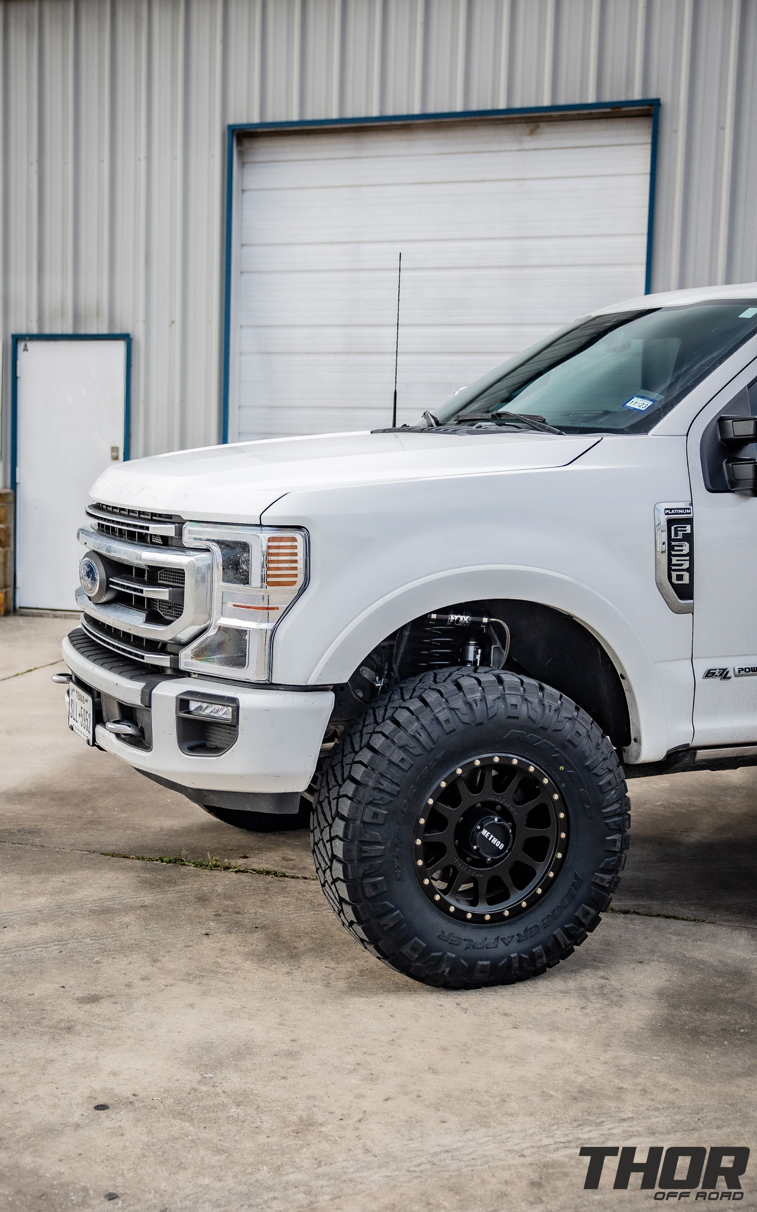 2022 Ford F-350 Super Duty Platinum in White with Carli Backcountry 3.5" Suspension Kit, Carli High Mount Steering Stabilizer, Carli Torsion Sway Bar, Method MR704 17x9" Bead Grip Wheels, 37x12.50R17 Toyo Open Country A/T III Tires