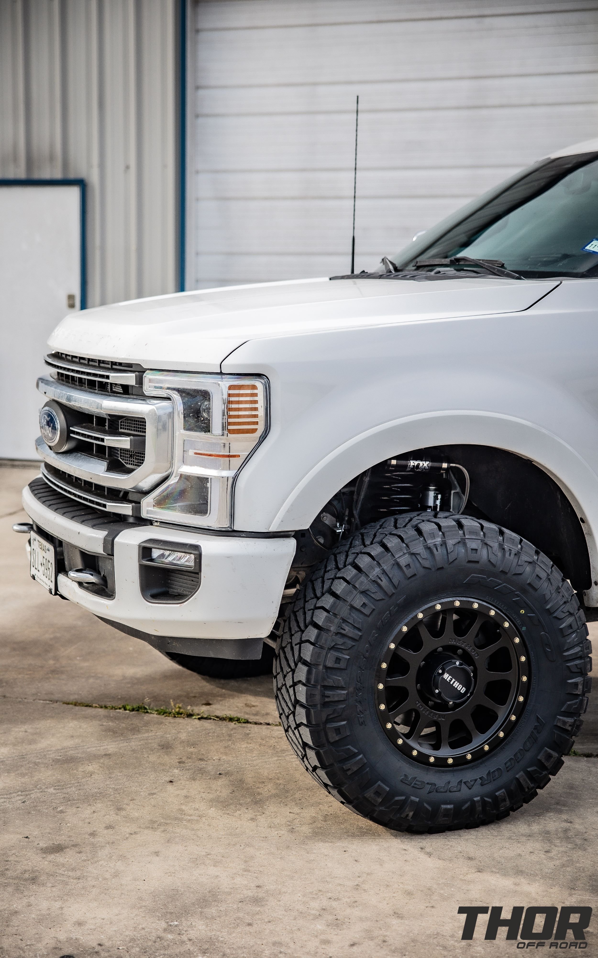 2022 Ford F-350 Super Duty Platinum in White with Carli Backcountry 3.5" Suspension Kit, Carli High Mount Steering Stabilizer, Carli Torsion Sway Bar, Method MR704 17x9" Bead Grip Wheels, 37x12.50R17 Toyo Open Country A/T III Tires