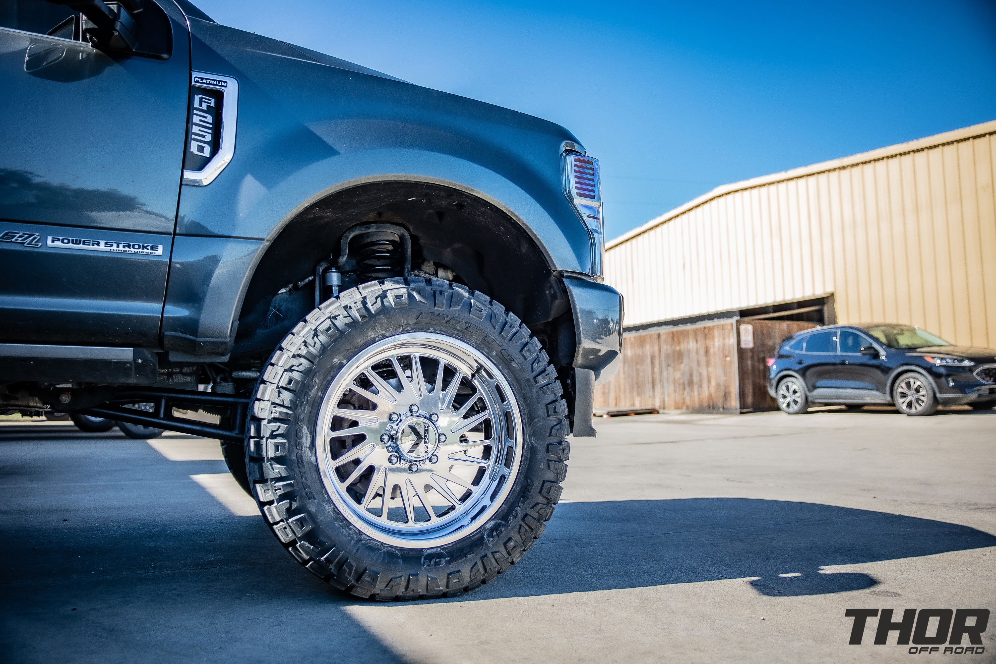 2020 Ford F-250 Super Duty Platinum in Grey with BDS 4" RA Suspension Kit with Fox 2.0 Shocks, KG1 22x10" Javelin Wheels, 37x12.50R22 Nitto Ridge Grappler Tires, Tremor Air Dam