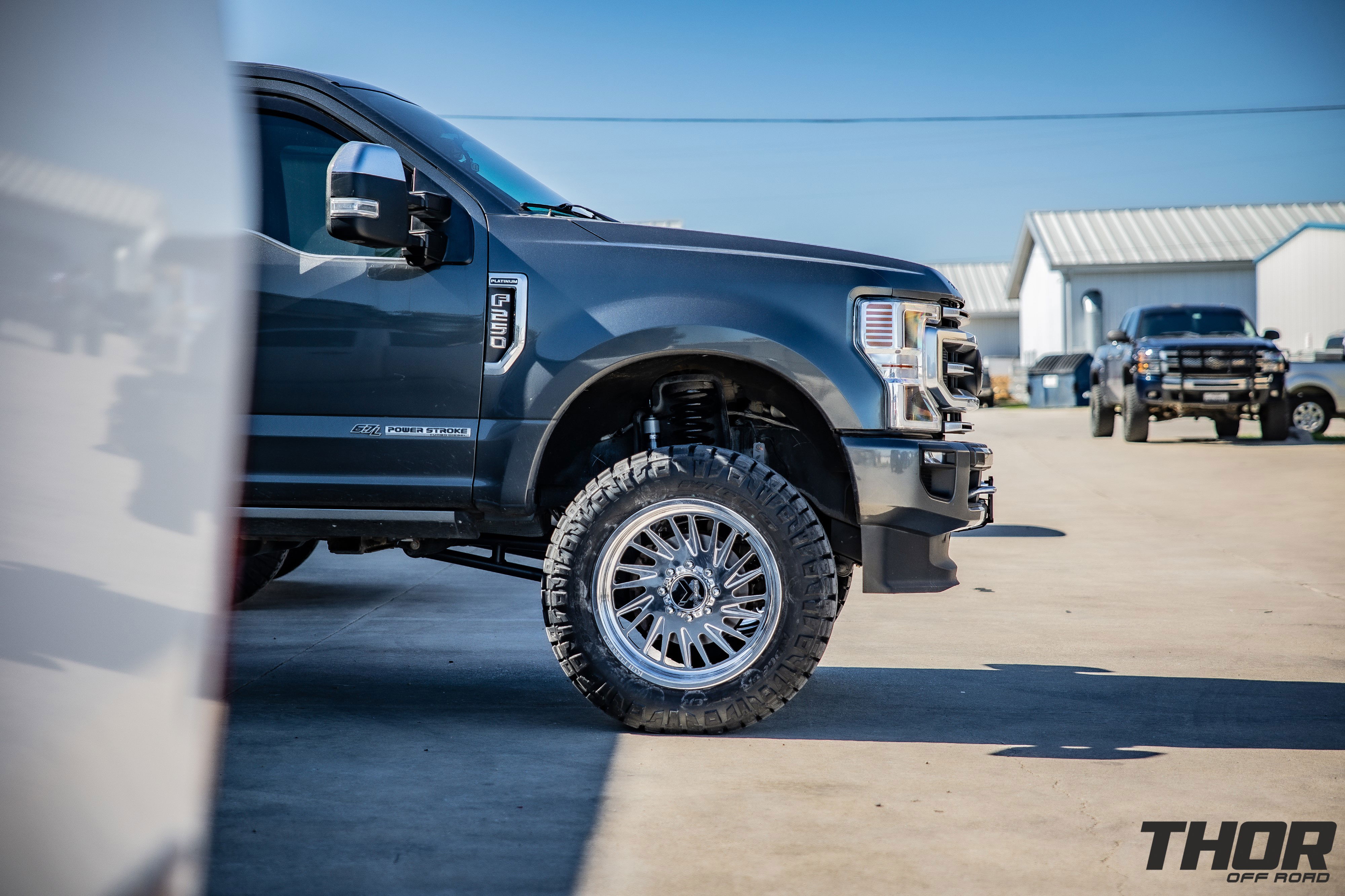 2020 Ford F-250 Super Duty Platinum in Grey with BDS 4" RA Suspension Kit with Fox 2.0 Shocks, KG1 22x10" Javelin Wheels, 37x12.50R22 Nitto Ridge Grappler Tires, Tremor Air Dam