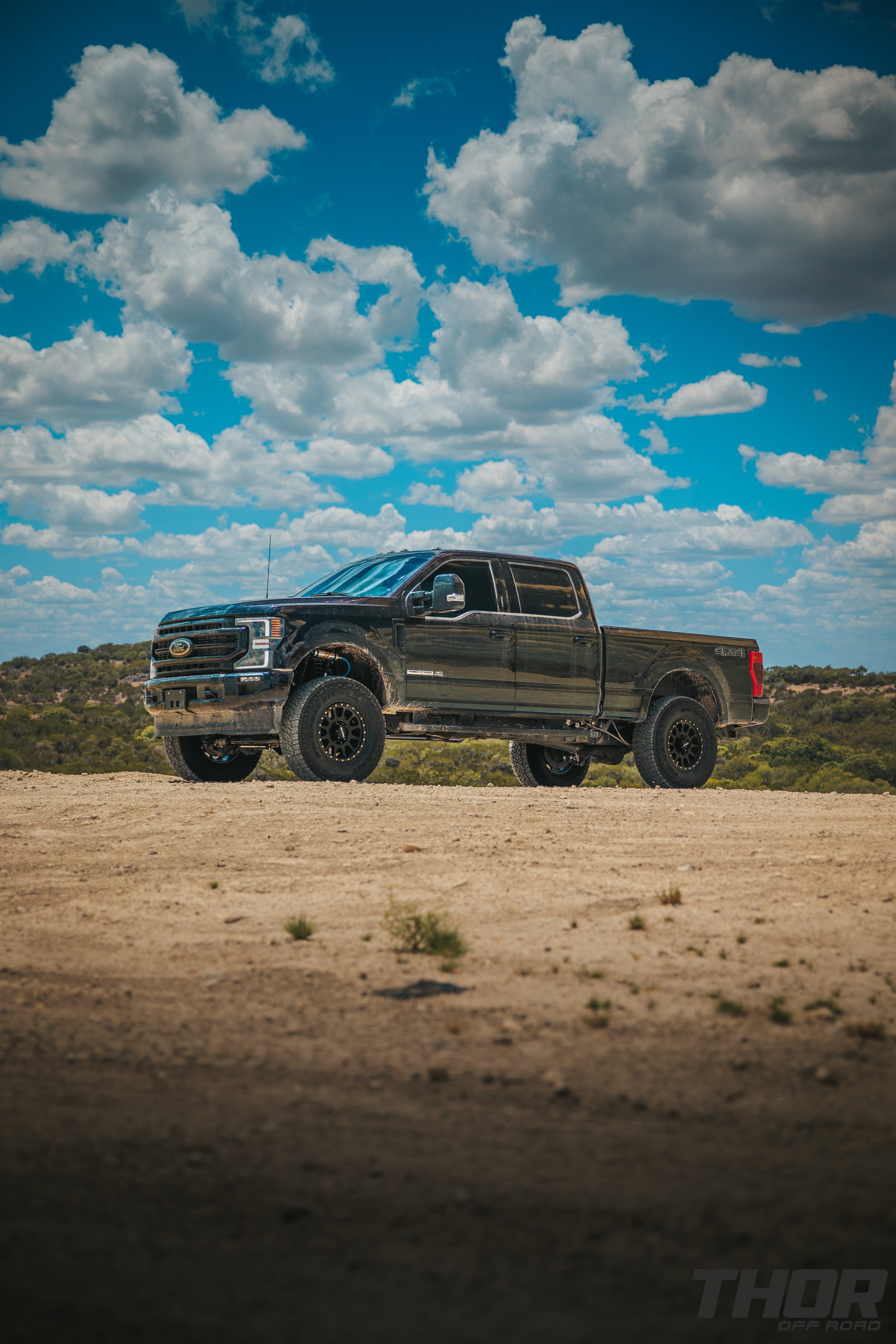 2022 Ford F-250 Super Duty Lariat in Black with Carli 3.5" Pintop Suspension Kit, Carli Torsion Sway Bar, Carli High Mount Steering Stabilizer, Carli Low Mount Steering Stabilizer, Carli Radius Arms, Air Bag Lift Kit with Wireless Controller, 18x9" Method MR305 NV Matte Black Wheels, 37x12.50R18 Falken Wildpeak A/T3W Tires