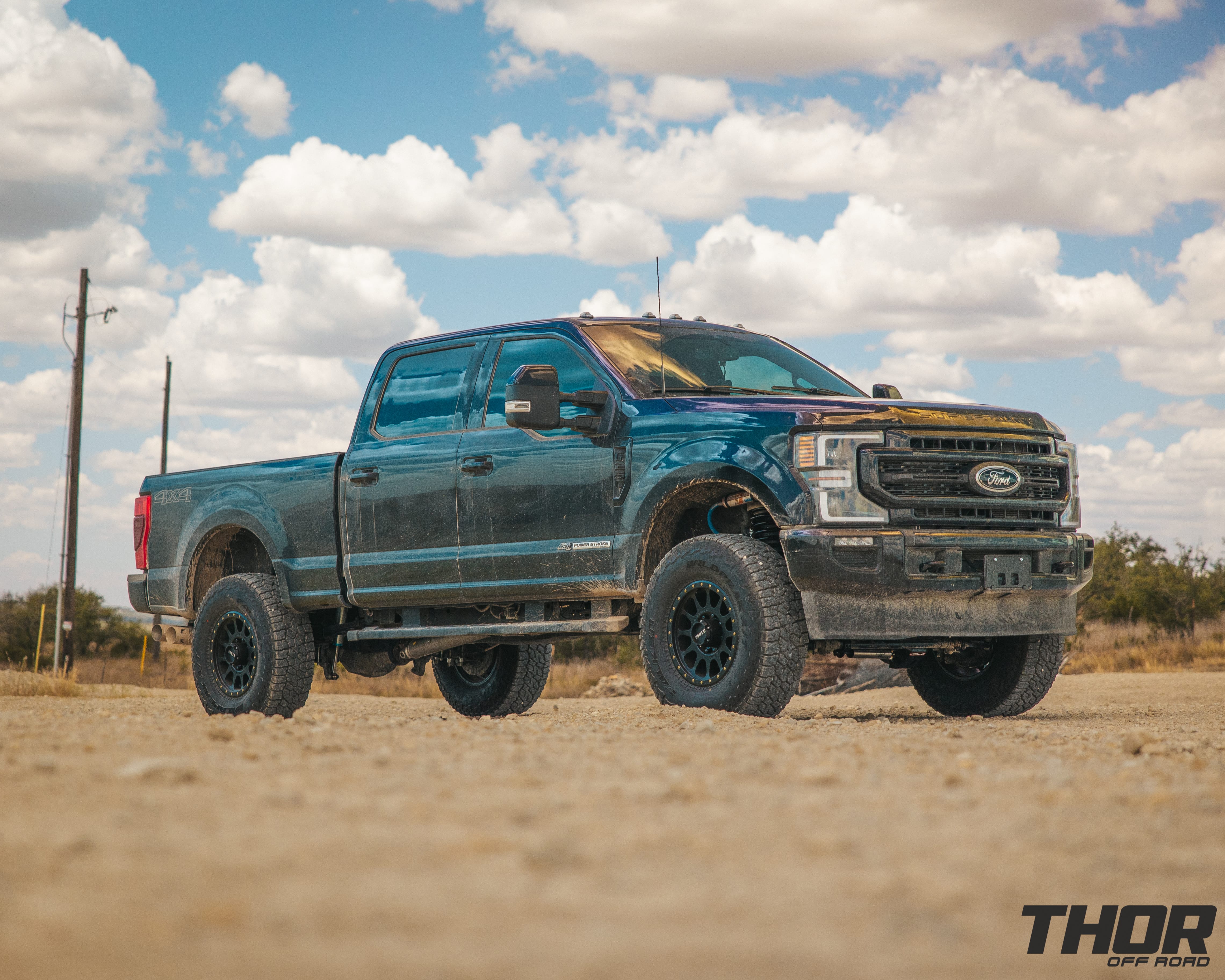 2022 Ford F-250 Super Duty Lariat in Black with Carli 3.5" Pintop Suspension Kit, Carli Torsion Sway Bar, Carli High Mount Steering Stabilizer, Carli Low Mount Steering Stabilizer, Carli Radius Arms, Air Bag Lift Kit with Wireless Controller, 18x9" Method MR305 NV Matte Black Wheels, 37x12.50R18 Falken Wildpeak A/T3W Tires