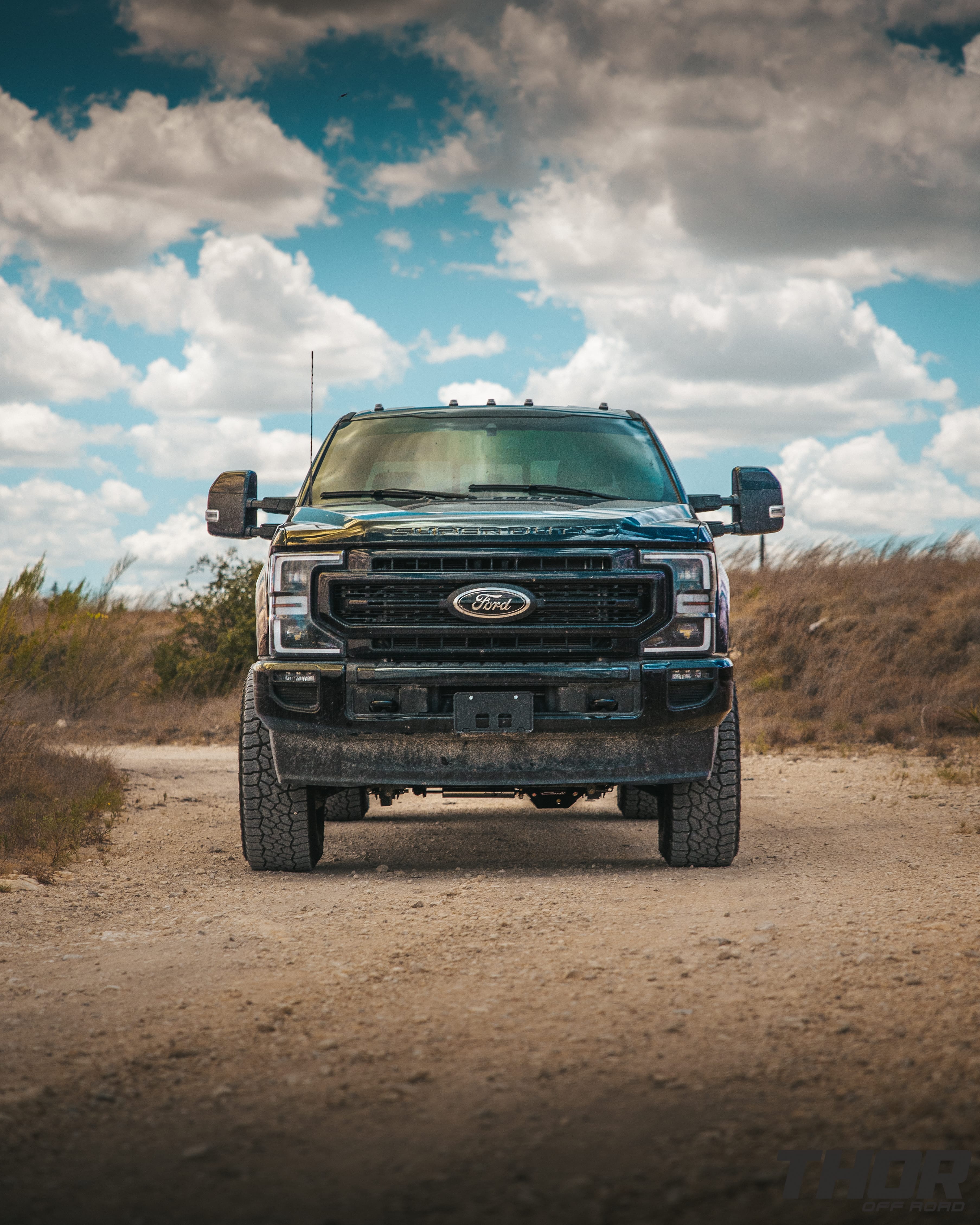 2022 Ford F-250 Super Duty Lariat in Black with Carli 3.5" Pintop Suspension Kit, Carli Torsion Sway Bar, Carli High Mount Steering Stabilizer, Carli Low Mount Steering Stabilizer, Carli Radius Arms, Air Bag Lift Kit with Wireless Controller, 18x9" Method MR305 NV Matte Black Wheels, 37x12.50R18 Falken Wildpeak A/T3W Tires